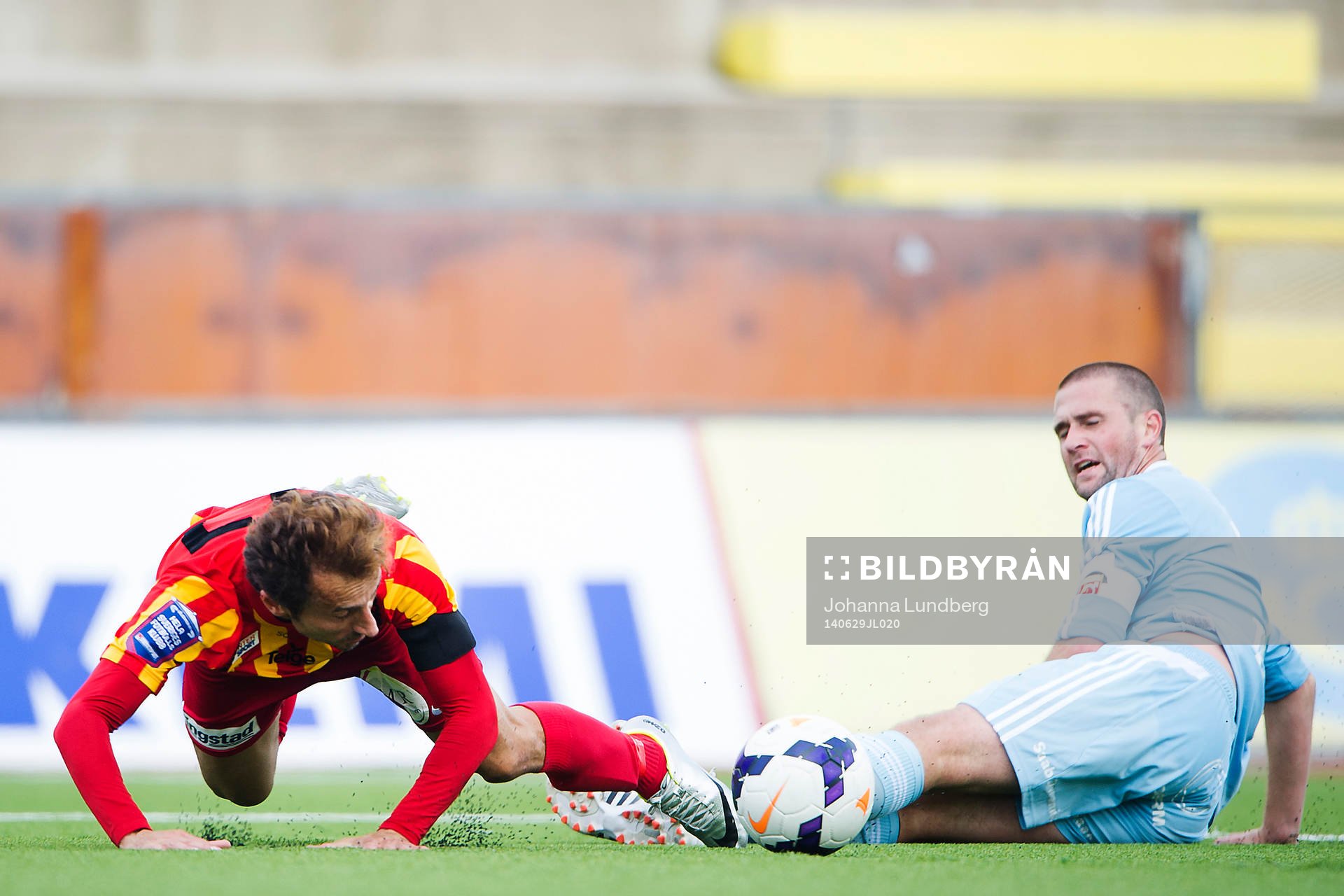 Degerfors Tobias Solberg kapar Syrianskas Louay Chanko och orsakar en straff under fotbollsmatchen i Superettan mellan Syrianska och Degerfors den 29 juni 2014 i Södertälje.