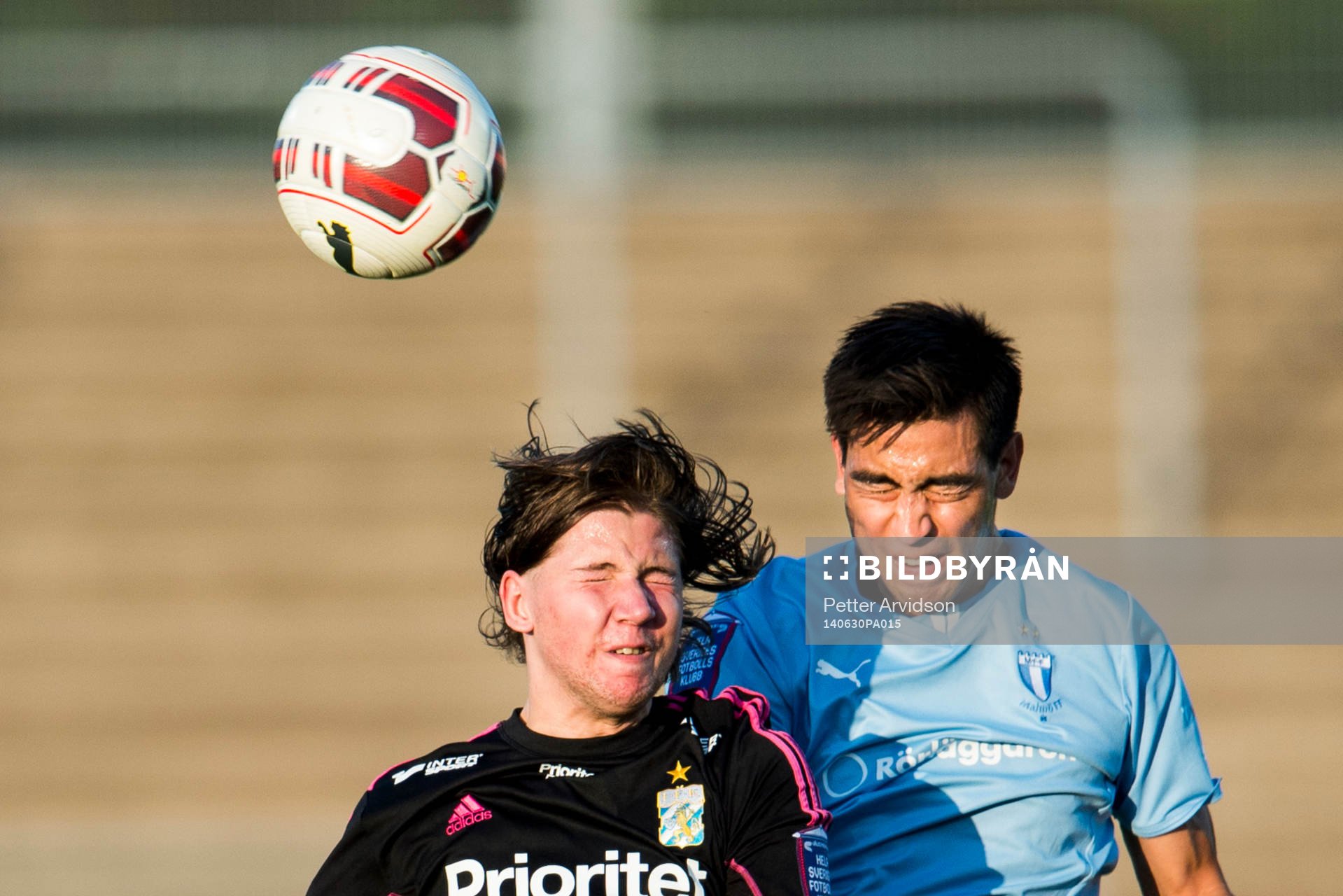 IFK Göteborgs Darijan Bojanic i nickduell med Malmö FFs Amin Nazari under fotbollsmatchen i Folksam U21 Allsvenskan Södra mellan Malmö FF och IFK Göteborg den 30 juni 2014 i Malmö.