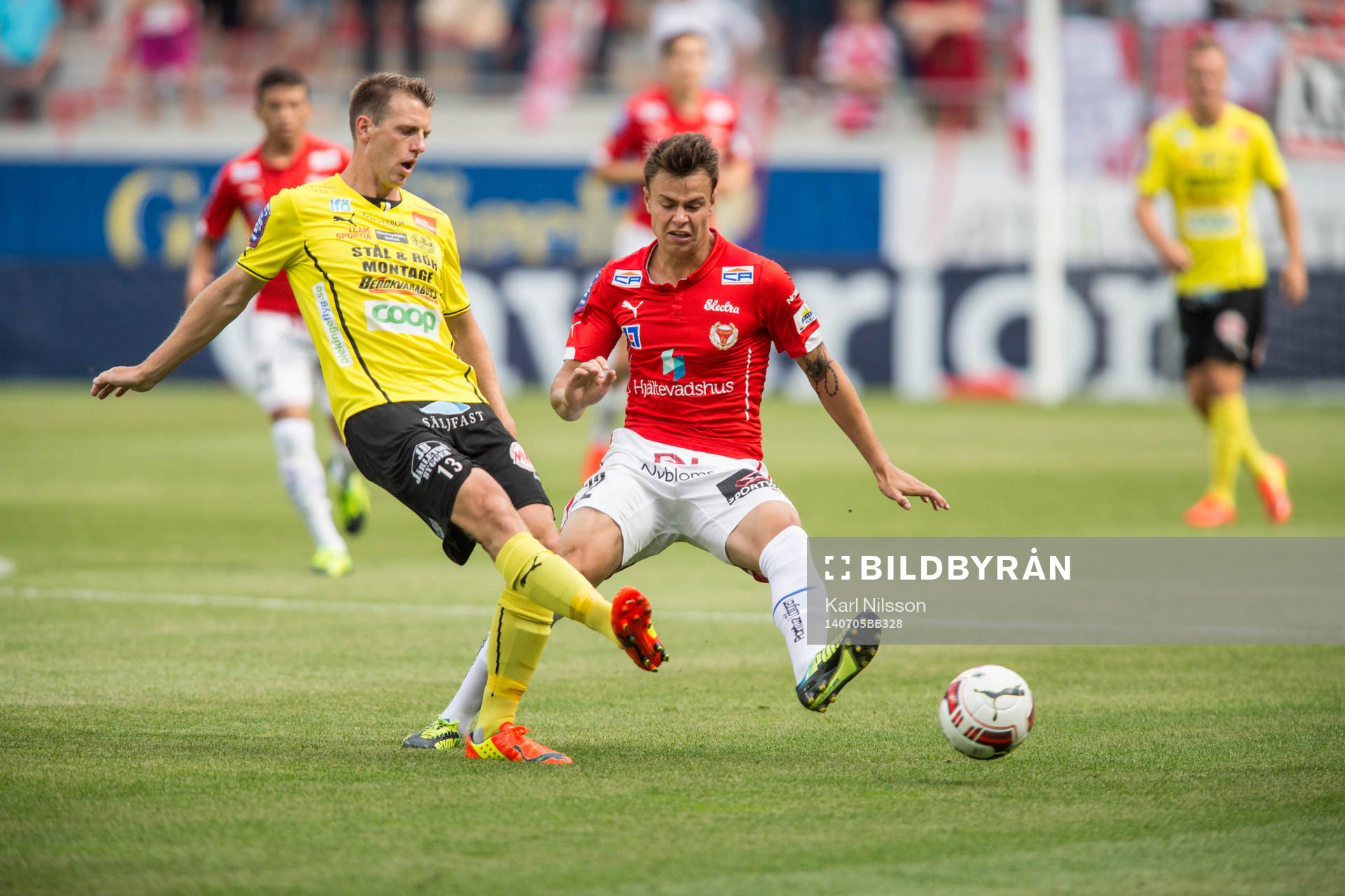 Mjällbys Daniel Nilsson och Kalmars Melker Hallberg under fotbollsmatchen i  i Allsvenskan mellan Kalmar och Mjällby den 5 juli 2014 i Kalmar.