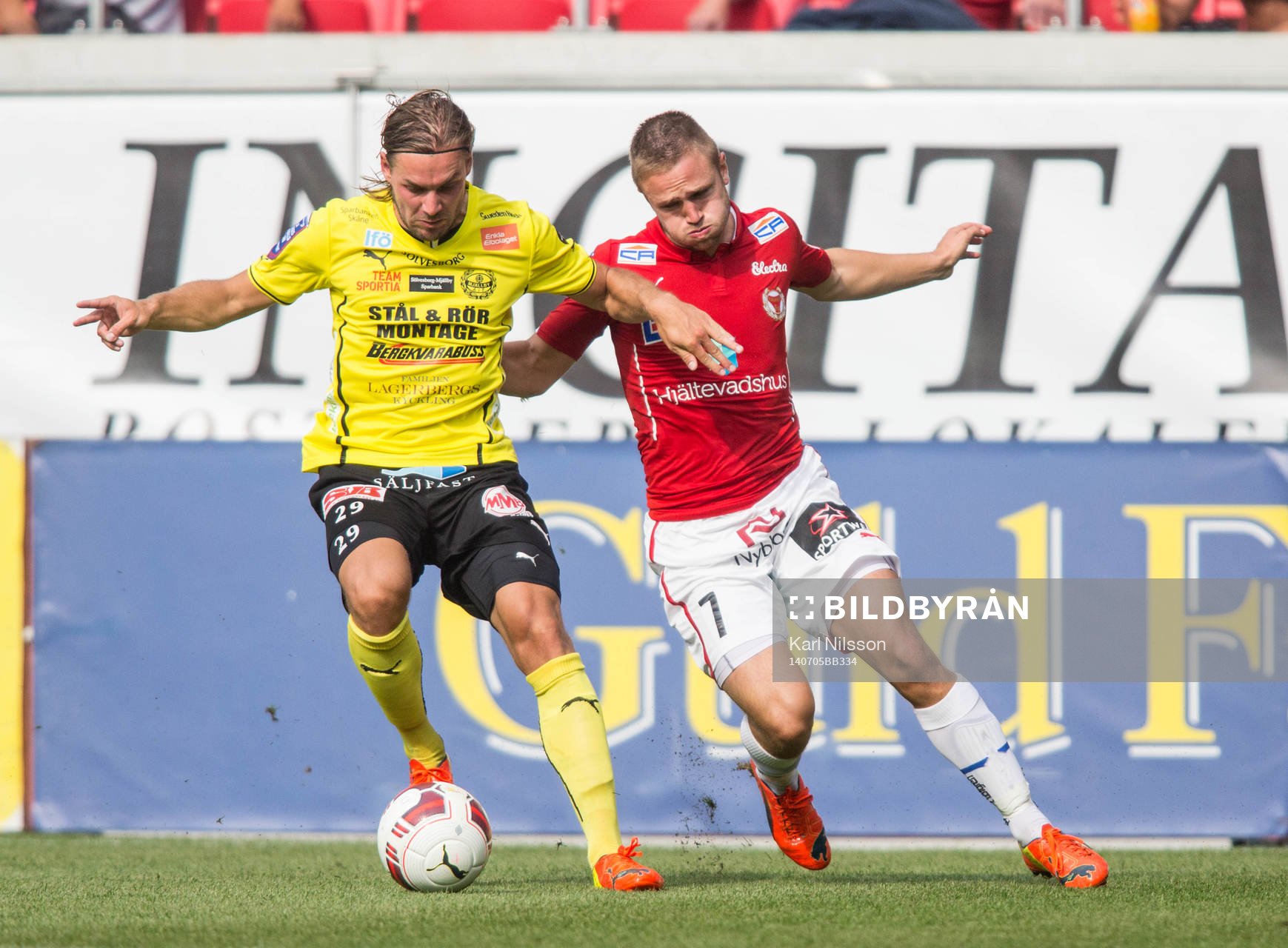 Mjällbys Danny Ervik och Kalmars Mats Solheim under fotbollsmatchen i  i Allsvenskan mellan Kalmar och Mjällby den 5 juli 2014 i Kalmar.
