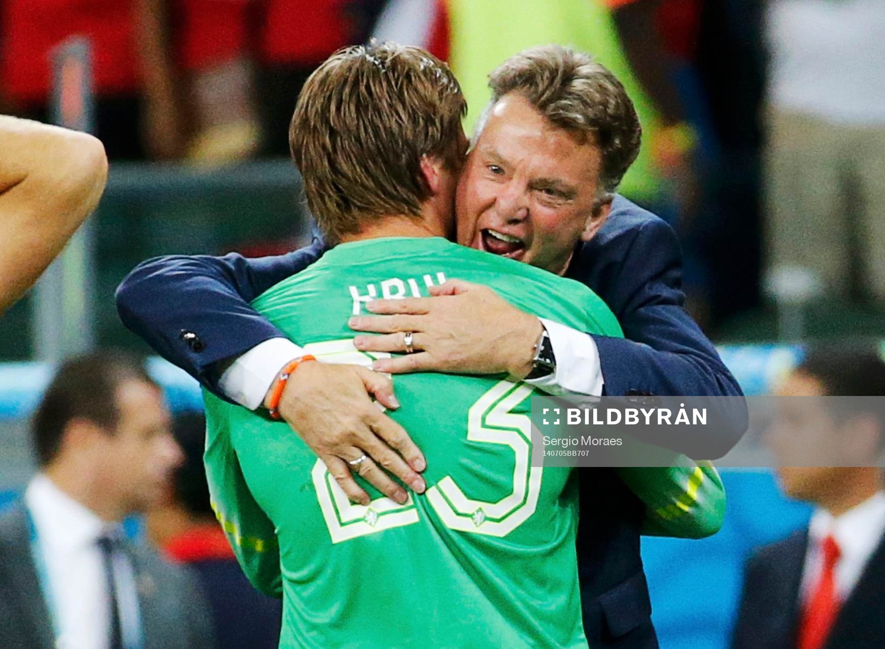Tim Krul of the Netherlands is hugged by coach Louis van
