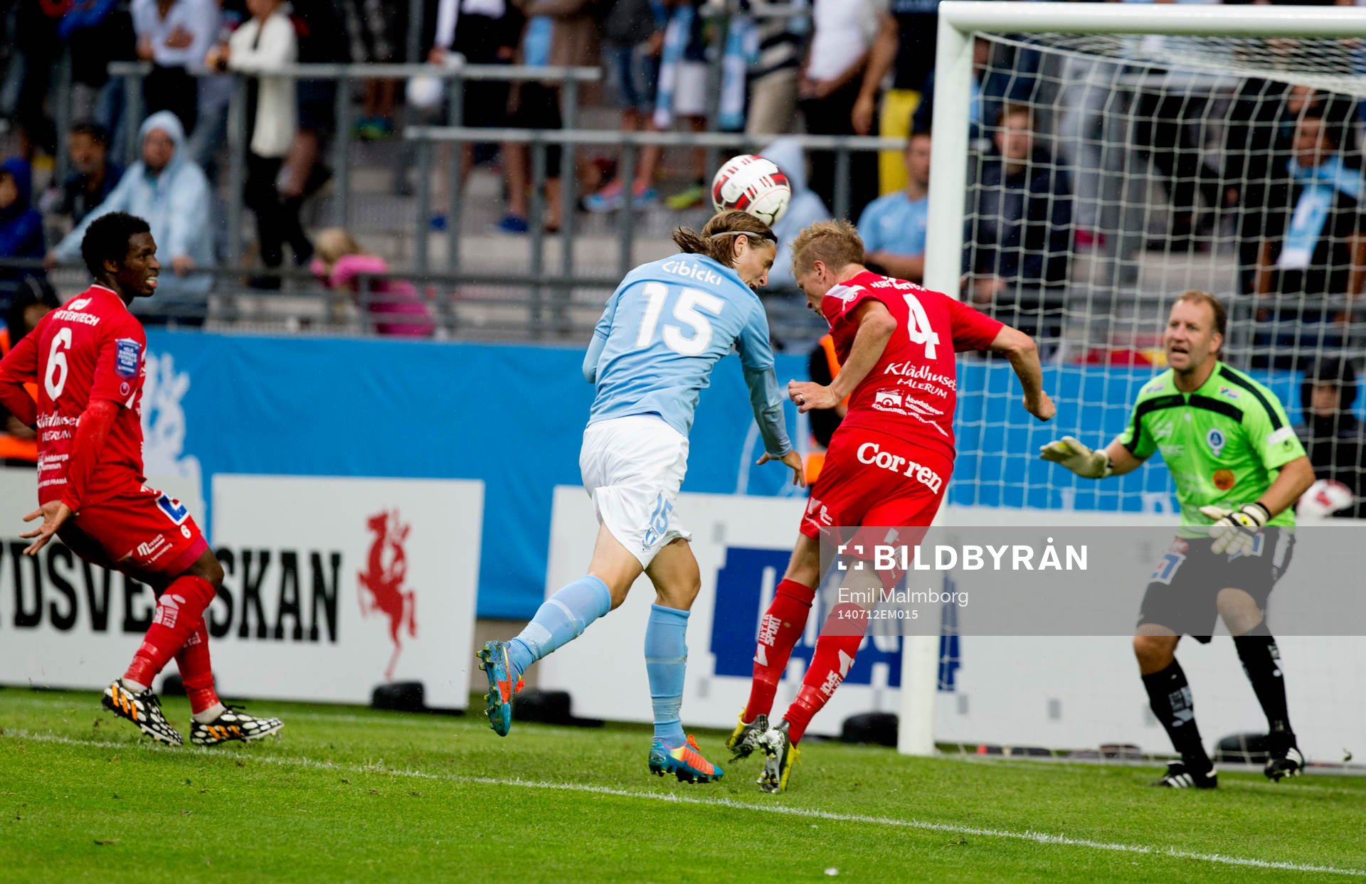 Pawel Cibicki från Malmö och Andreas Dahlén under matchen mellan Malmö och Åtvidaberg den 12 Juli 2014 i Malmö