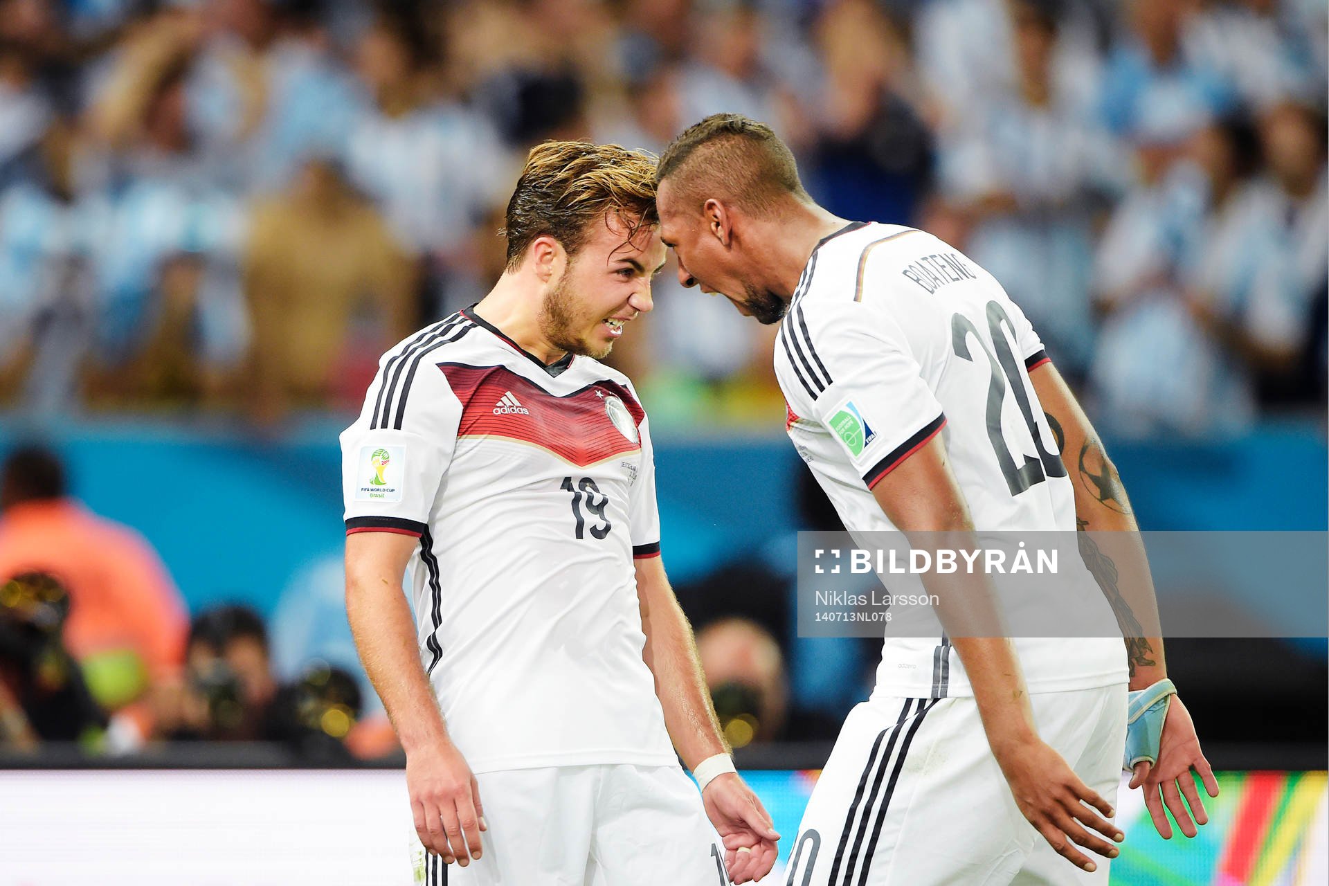 Tysklands Mario Götze och Jerome Boateng jublar