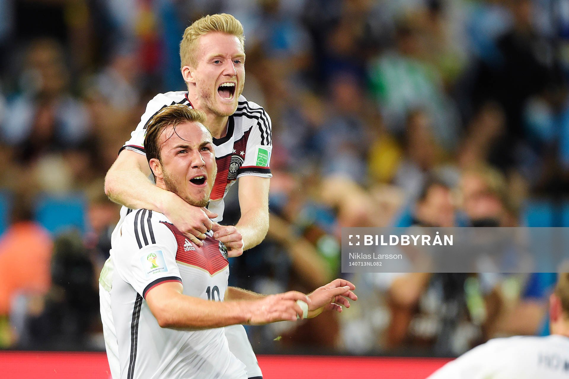 Tysklands Mario Götze och Andre Schuerrle jublar