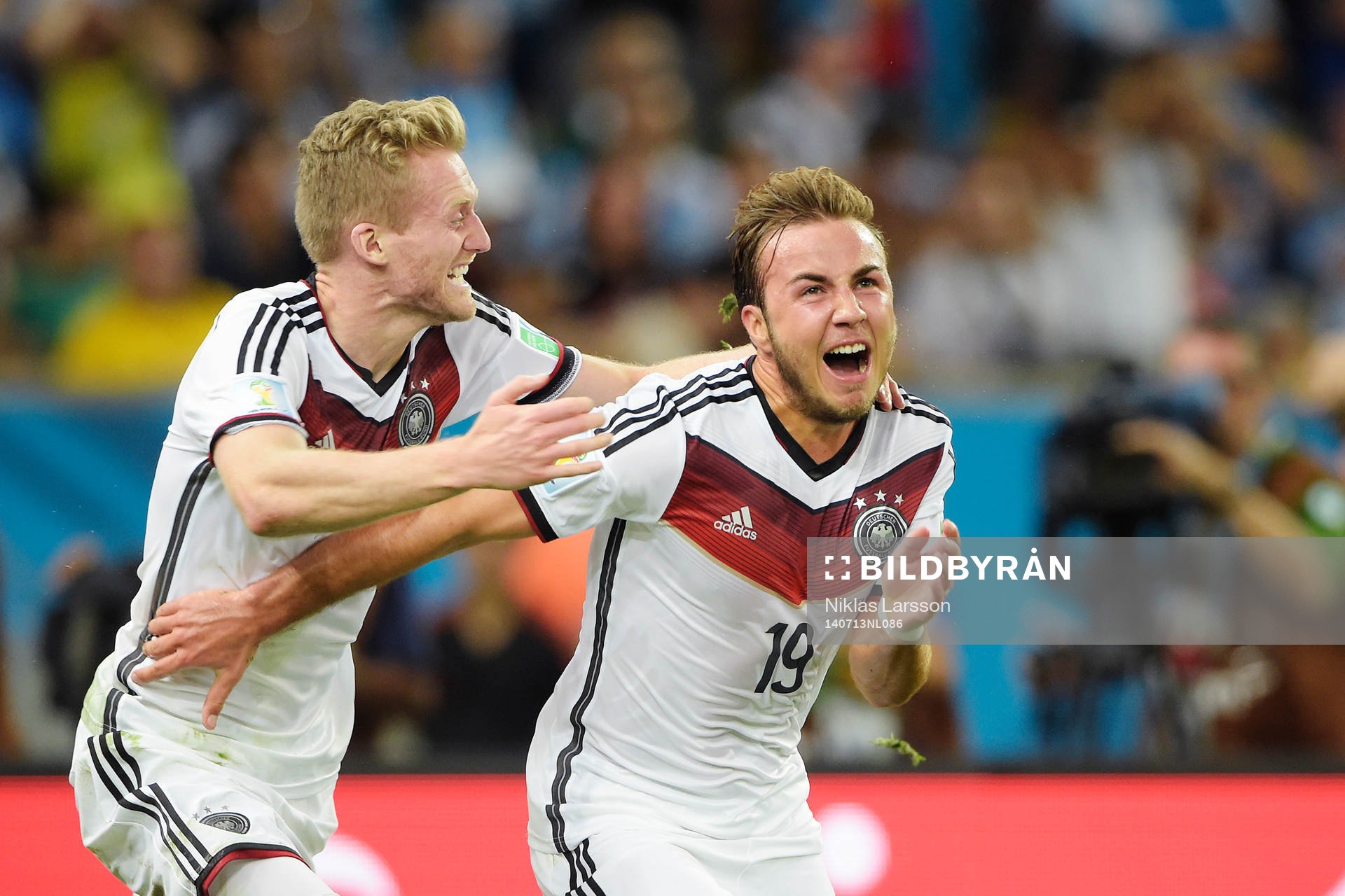 Tysklands Mario Götze och Andre Schuerrle jublar