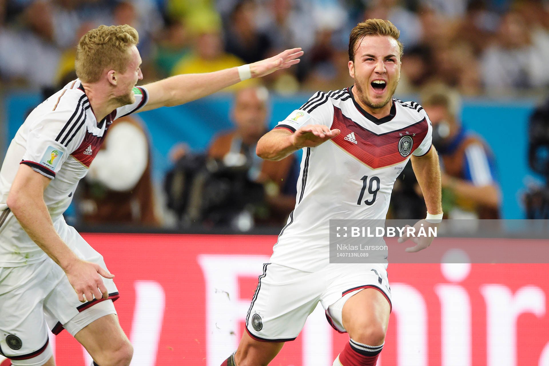 Tysklands Mario Götze och Andre Schuerrle jublar