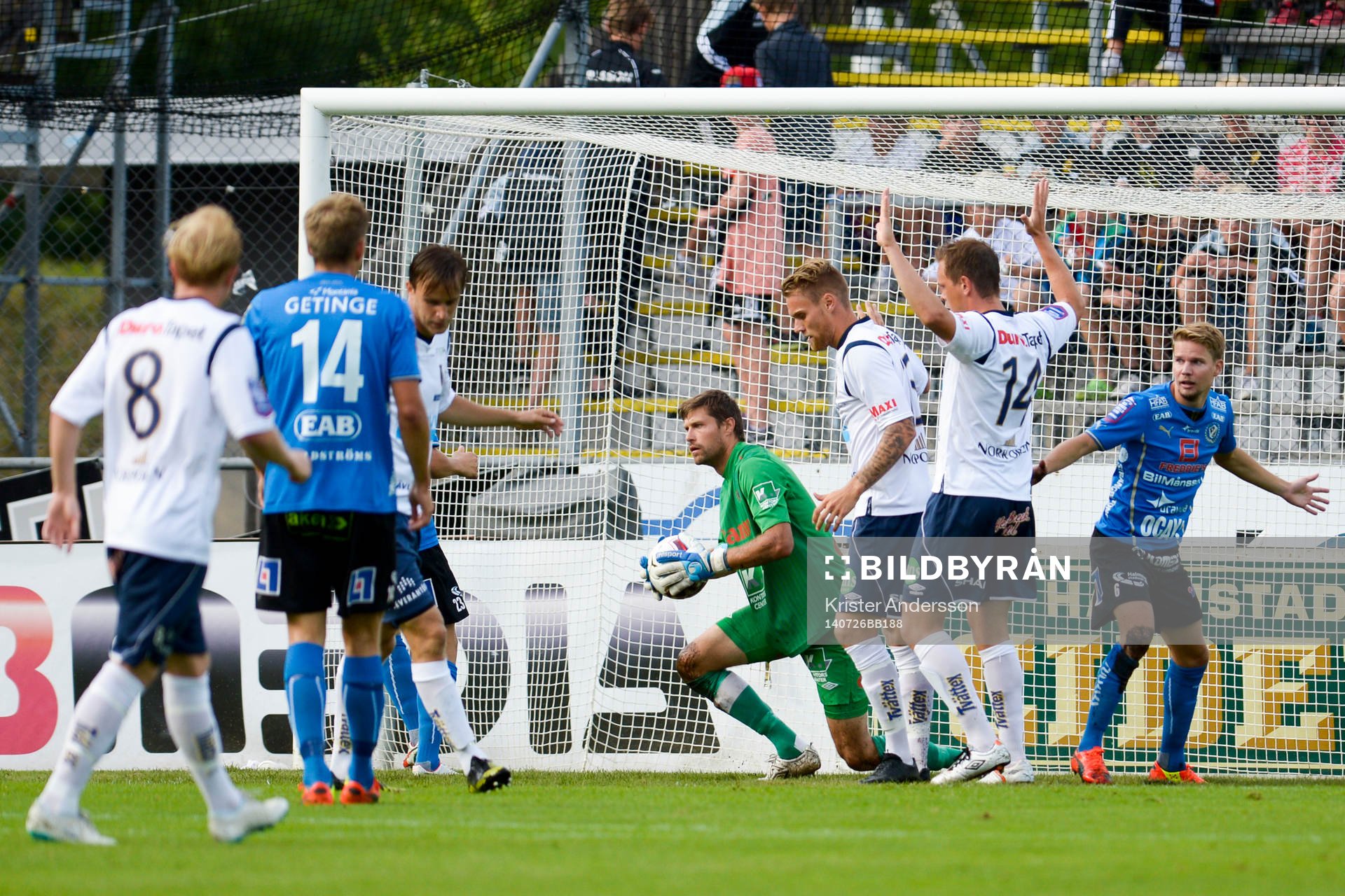 Gefles målvakt Emil Hedvall håller i bollen efter målchans genom Halmstads Johan Blomberg (th) under fotbollsmatchen i Allsvenskan mellan Halmstad och Gefle den 26 juli 2014 i Halmstad.