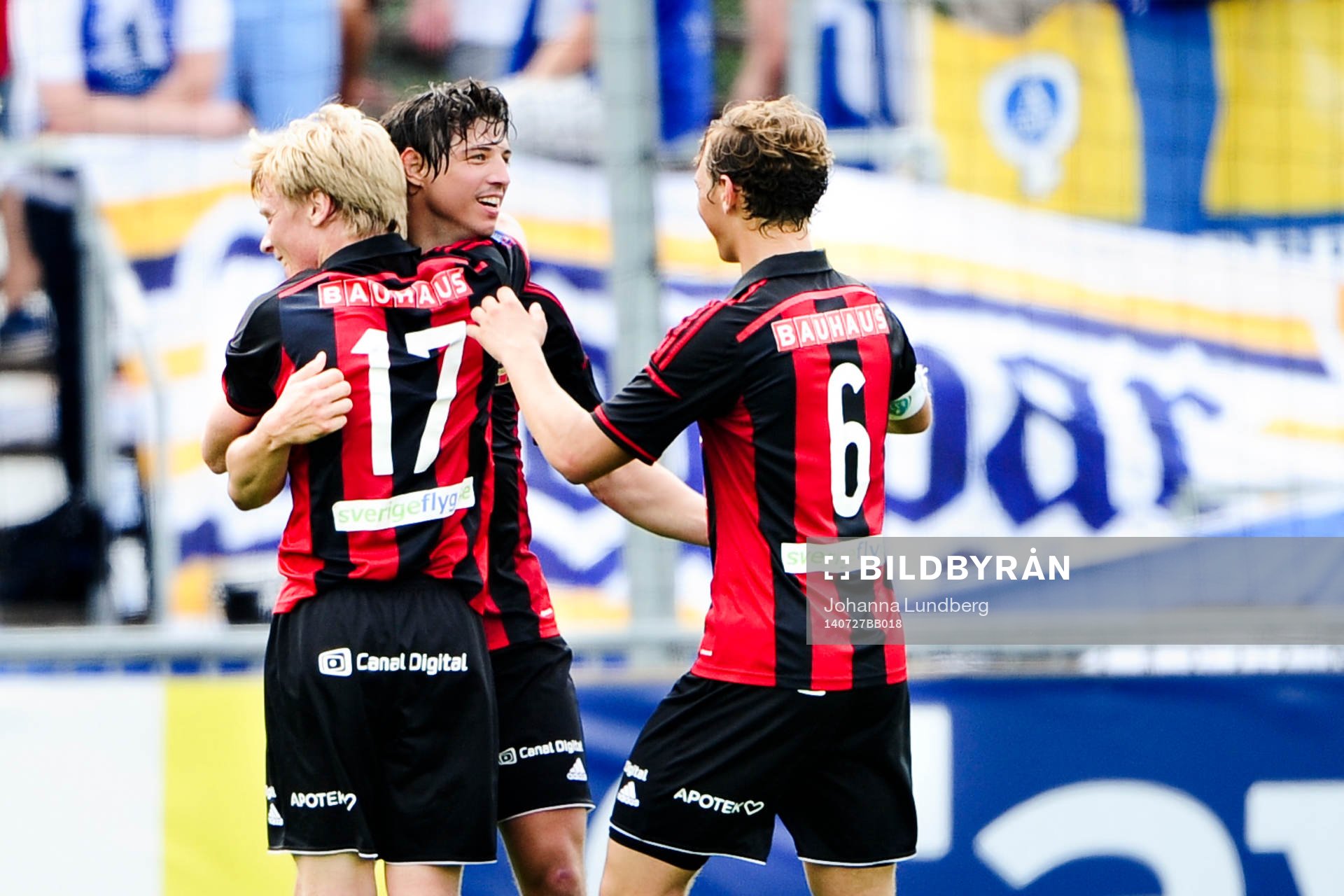 Brommapojkarnas Gabriel Petrovic (m) gör 2-0 och kramas om av Gustav Sandberg Magnusson (tv) och Jesper Karlström (th) under fotbollsmatchen i Allsvenskan mellan Brommapojkarna och Åtvidaberg den 27 juli 2014 i Stockholm. 