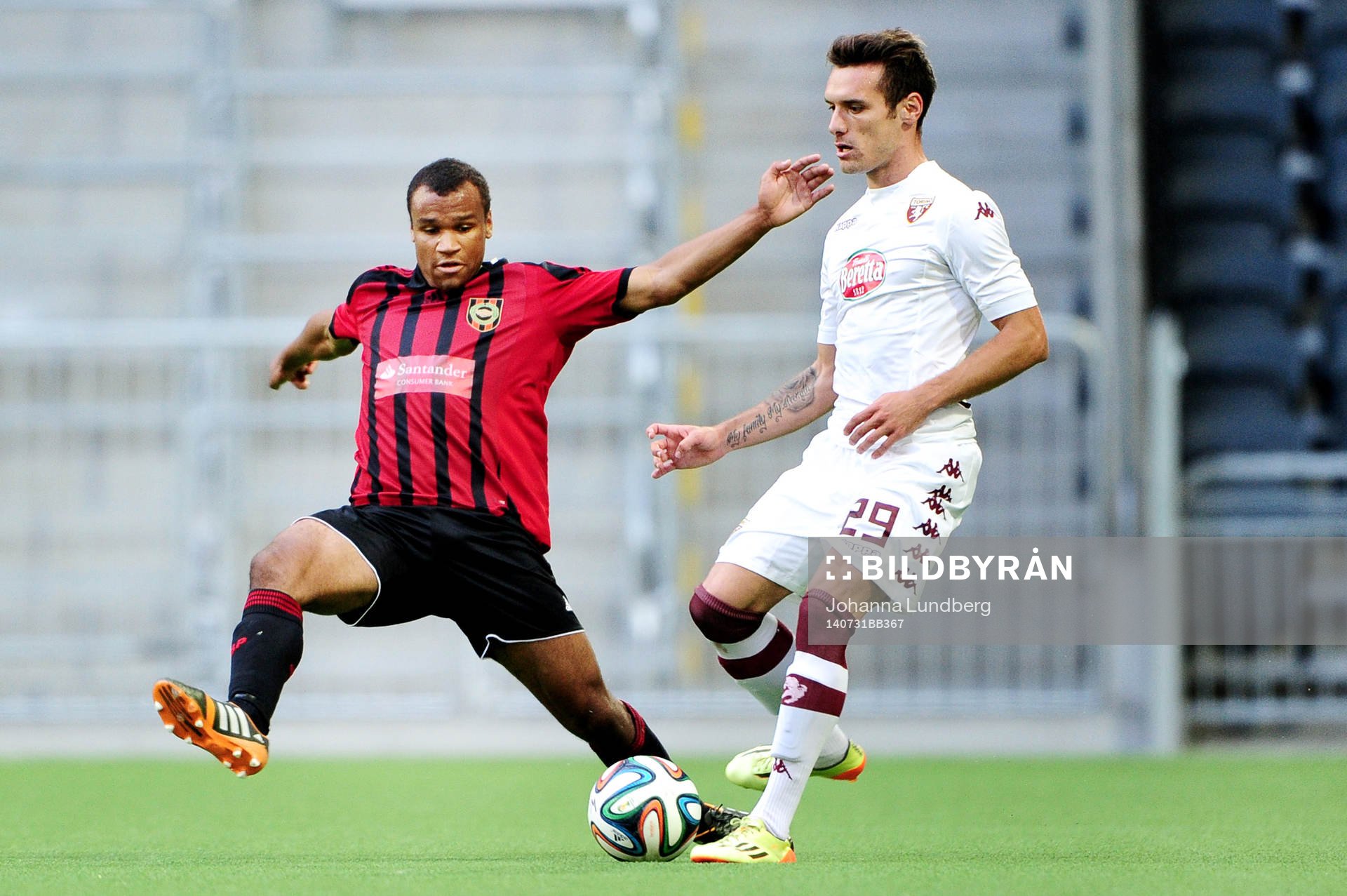Brommapojkarnas Serge-Junior Martinsson Ngouali jagar Torinos Marko Vesovic under fotbollsmatchen i kvalet till Europa League mellan Brommapojkarna och Torino den 30 juli 2014 i Stockholm.