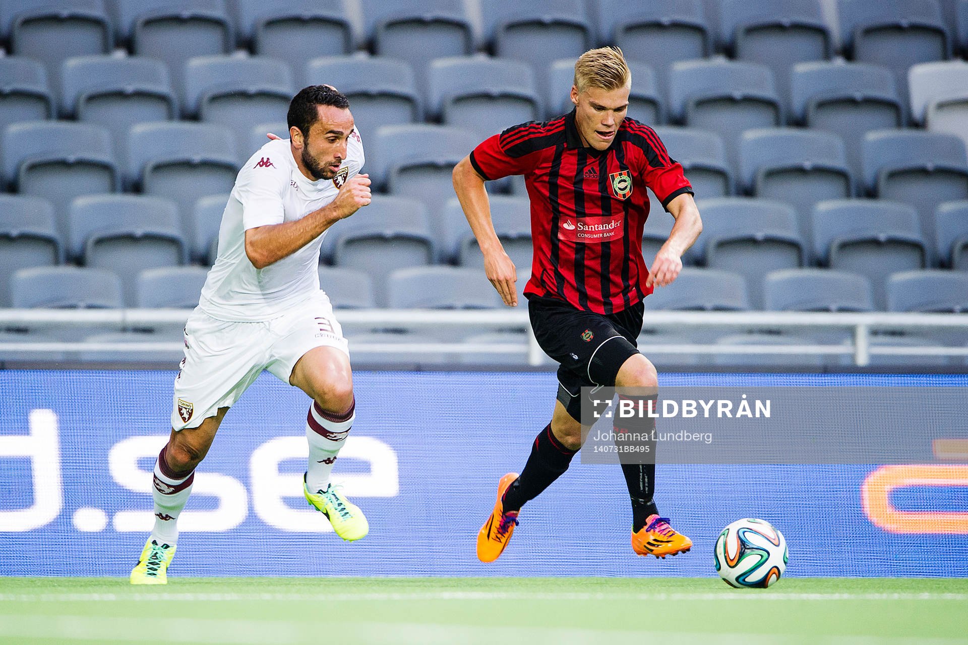 orinos Cristian Molinaro och Brommapojkarnas Martin Falkeborn under fotbollsmatchen i kvalet till Europa League mellan Brommapojkarna och Torino den 30 juli 2014 i Stockholm.