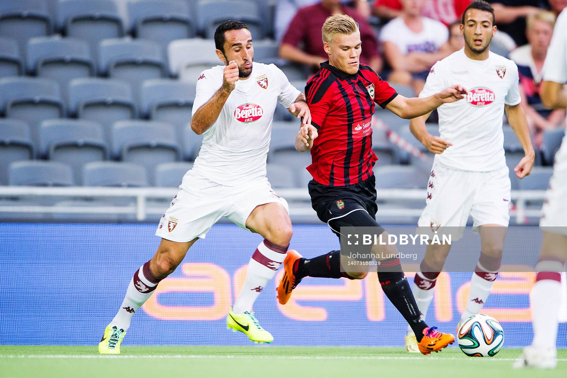 Torinos Cristian Molinaro och Brommapojkarnas Martin Falkeborn under fotbollsmatchen i kvalet till Europa League mellan Brommapojkarna och Torino den 30 juli 2014 i Stockholm.