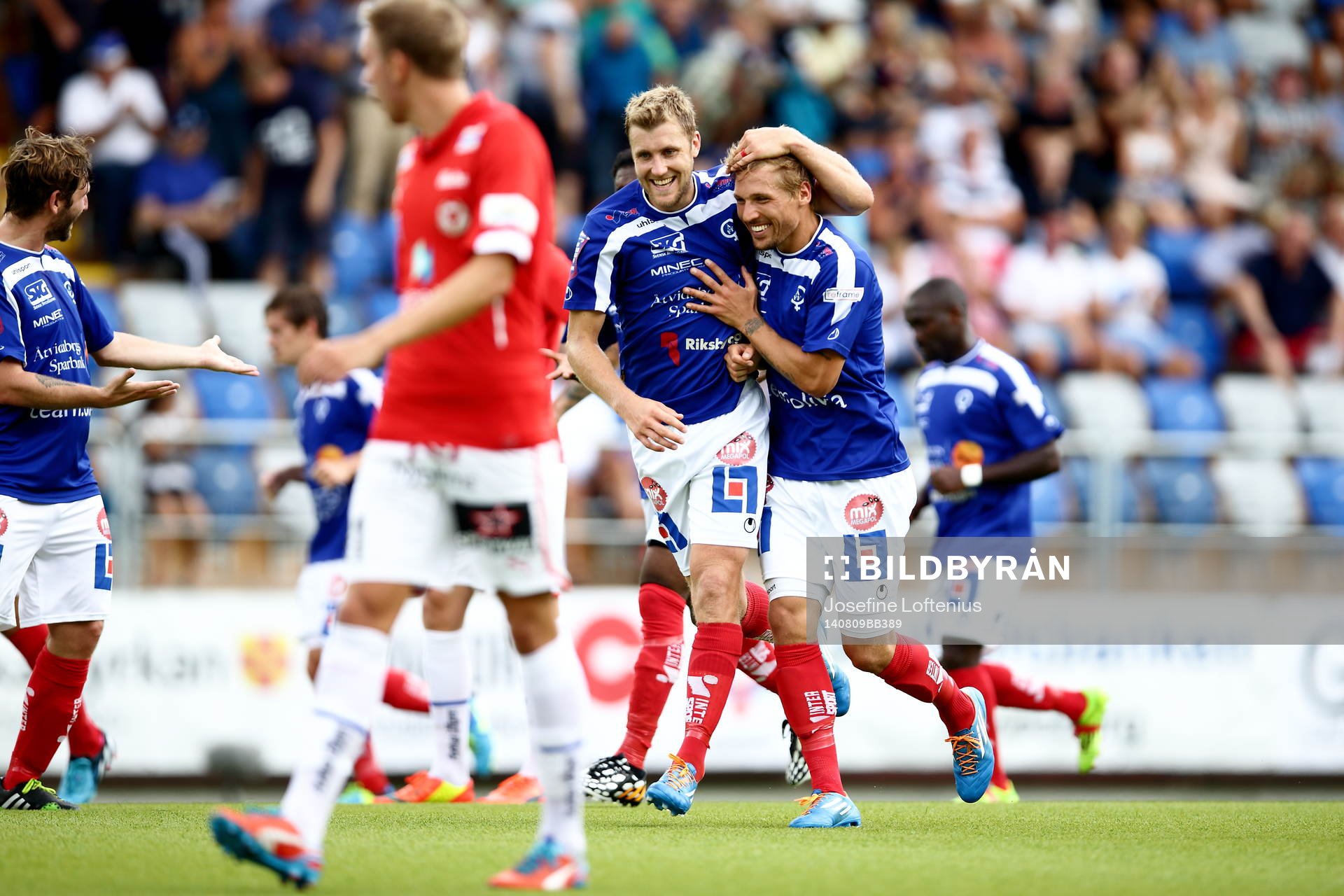 Åtvidabergs Daniel Hallingström och Martin Christensen jublar efter Martins andra mål under fotbollsmatchen i Allsvenskan mellan Åtvidaberg och Kalmar den 09 augusti 2014 i Åtvidaberg.
