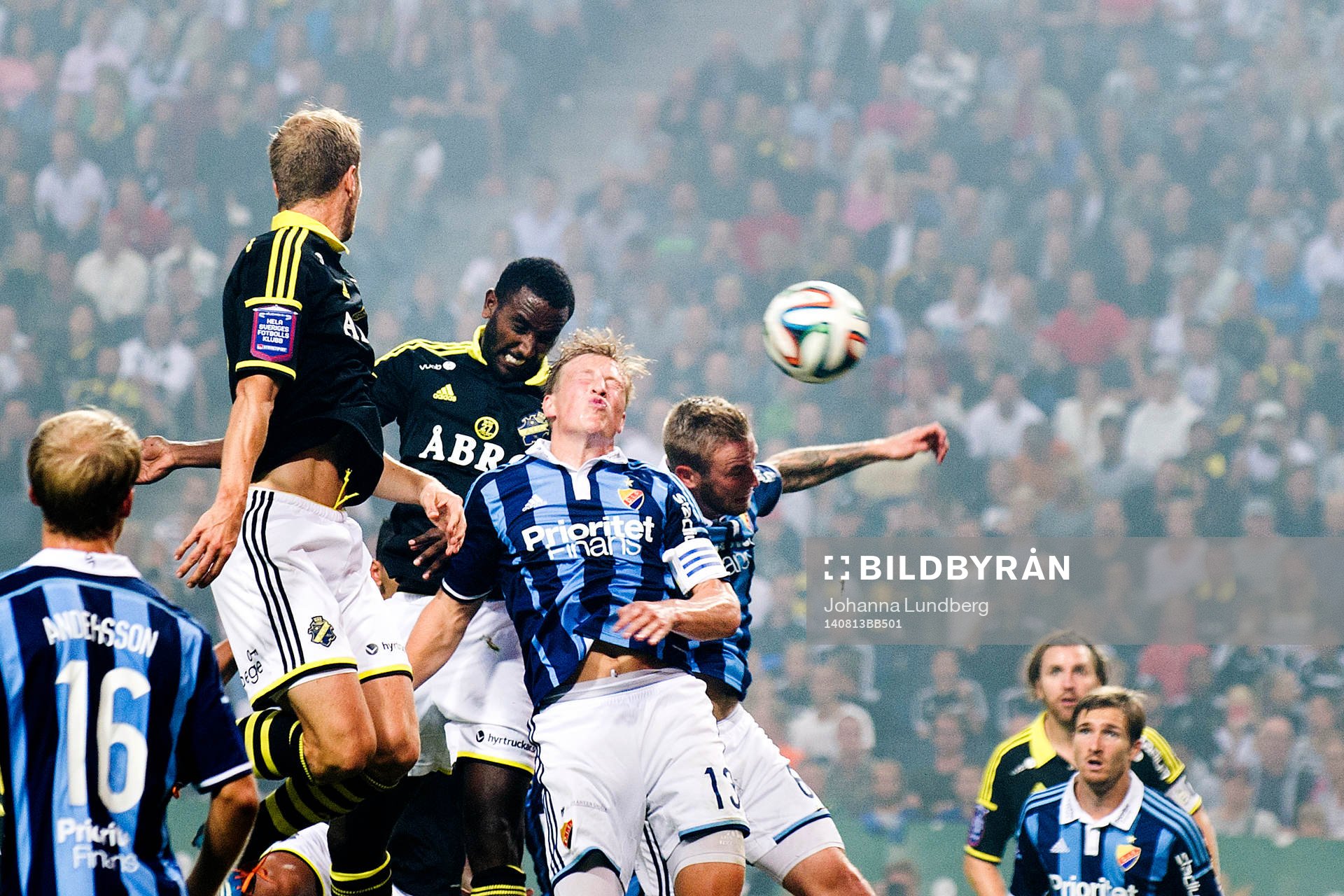 AIK:s Per Karlsson och Henok Goitom i en duell med Djurgårdens Emil Bergström och Aleksander Faltsetas under fotbollsmatchen i Allsvenskan mellan AIK och Djurgården den 13 augusti 2014 i Stockholm.