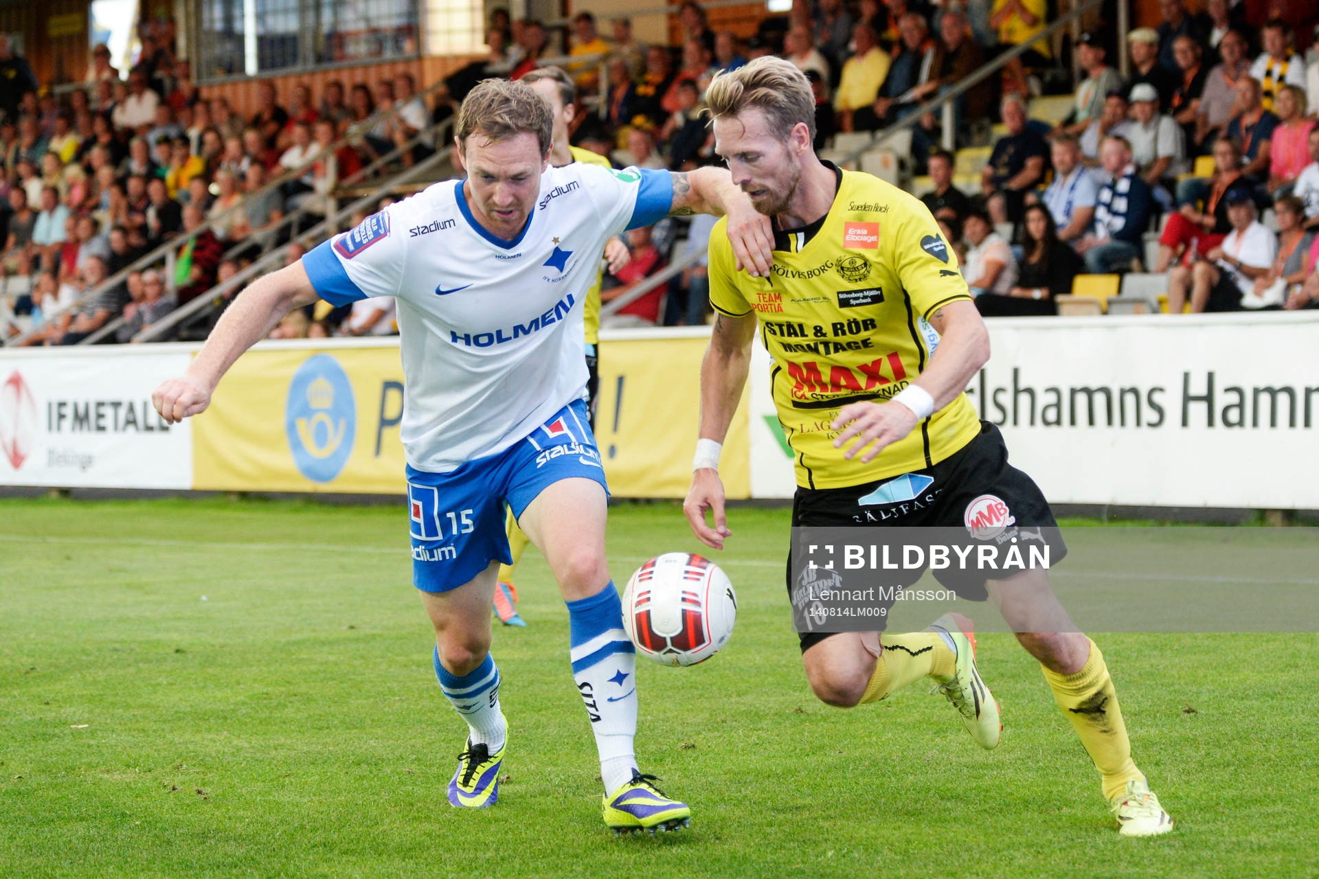 Mjällbys Christian Wilhelmsson och Norrköpings Marcus Falk Olander i den allsvenska fotbollsmatchen mellan Mjällby och IFK Norrköping i Hällevik 14 augusti 2014.