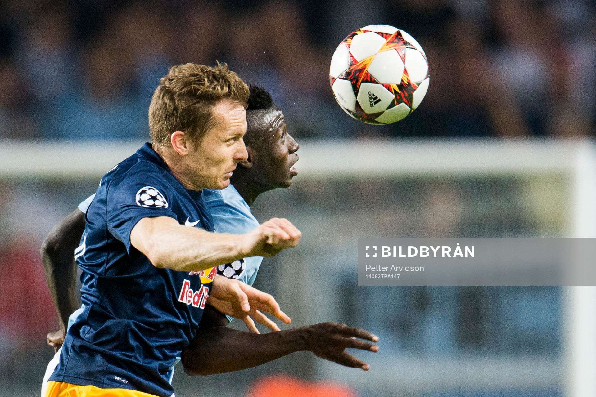 Salzburgs Christian Schwegler och Malmö FFs Pa Konate under kvalmatchen i Champions League mellan Malmö FF och Red Bull Salzburg den 27 augusti 2014 i Malmö.