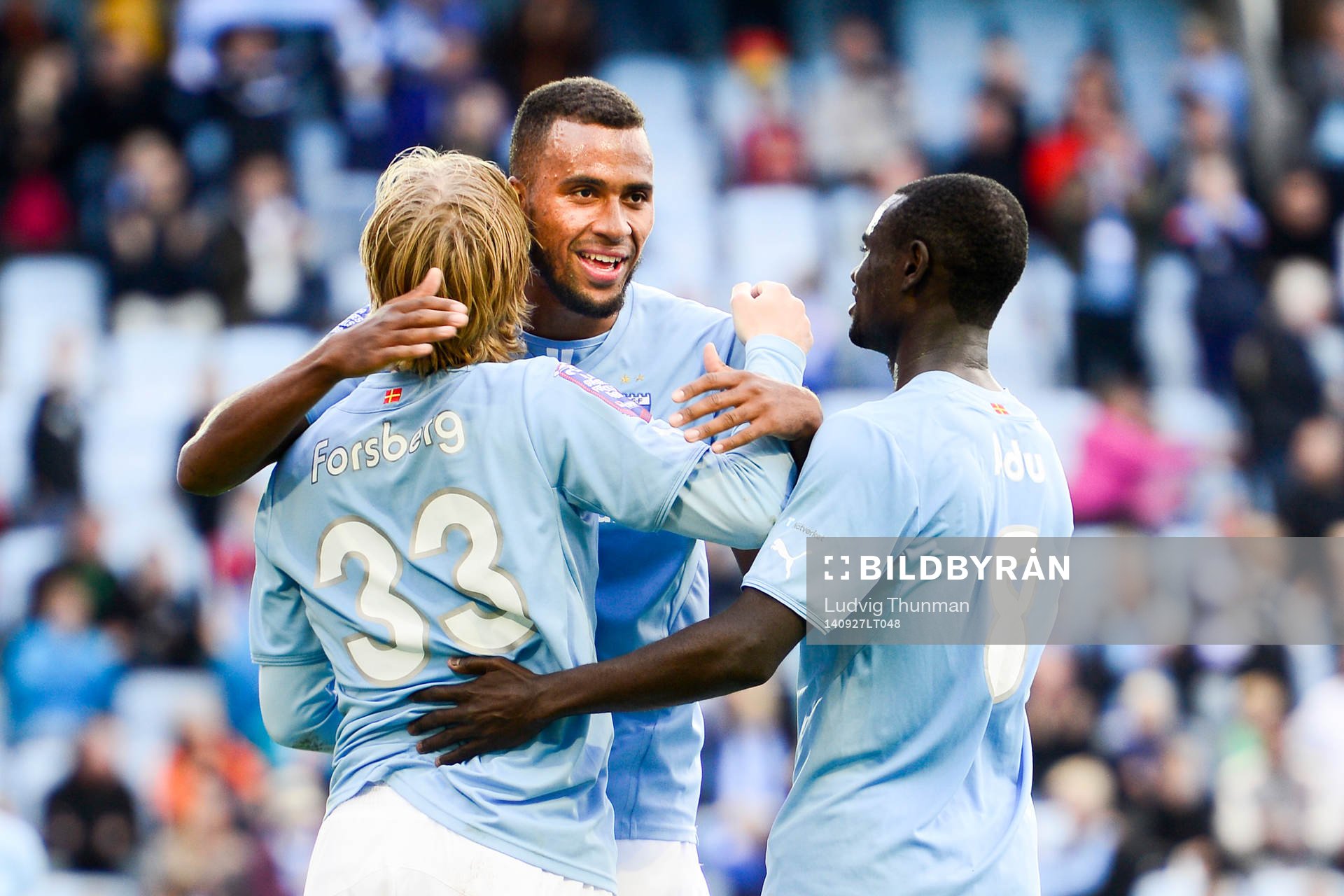 Malmö FFs Emil Forsberg kramas om av Isaac Kiese Thelin och Enock Kofi Adu under matchen i Allsvenskan mellan Malmö FF och Mjällby den 27 september 2014 i Malmö.