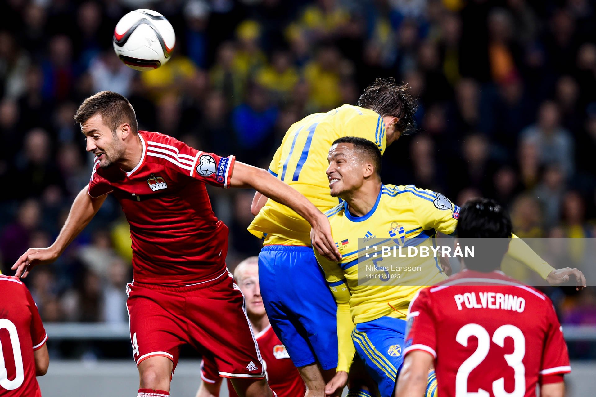 Liechtensteins Daniel Kaufmann och Sveriges Martin Olsson under fotbollsmatchen i EM-kvalet mellan Sverige och Liechtenstein den 12 oktober 2014 i Stockholm.