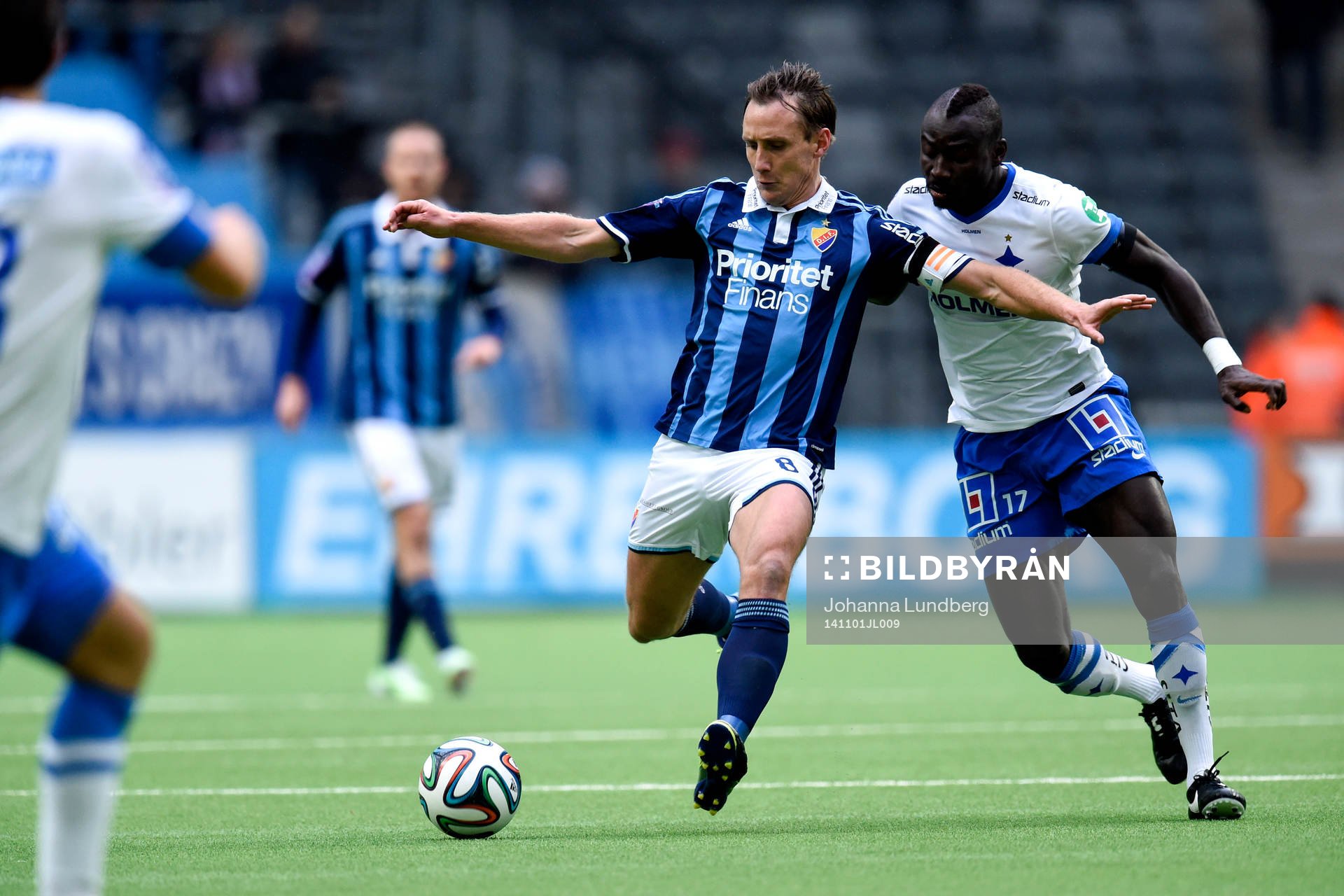 Djurgårdens Andreas Johansson och Norrköpings Alhaji Kamara under fotbollsmatchen i Allsvenskan mellan Djurgården och Norrköping den 1 november 2014 i Stockholm.