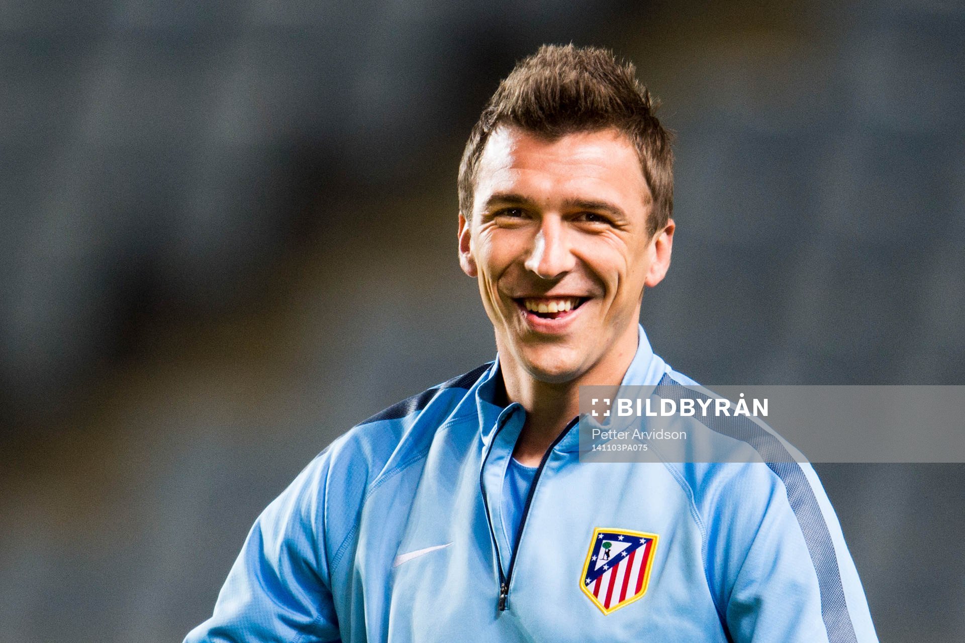 Atletico Madrids Mario Mandzukic skrattar