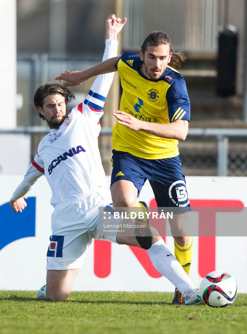 Assyriska försöker stoppa Ängelholms Vlado Zlojutro i matchen i Superettan mellan Ängelholm och Assyriska i Ängelholm 5 april 2015.