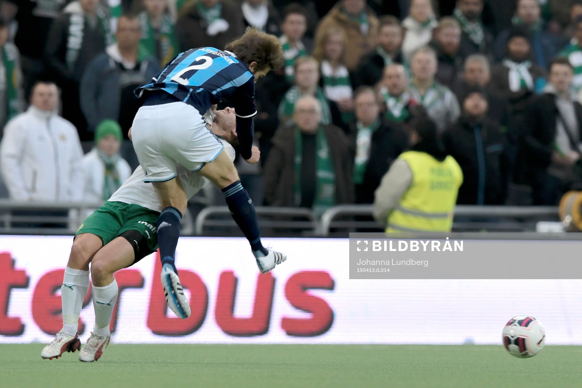 Hammarbys Mats Solheim blir tacklad av Djurgårdens Jesper Arvidsson under fotbollsmatchen i Allsvenskan mellan Hammarby och Djurgården den 13 april 2015 i Stockholm.
