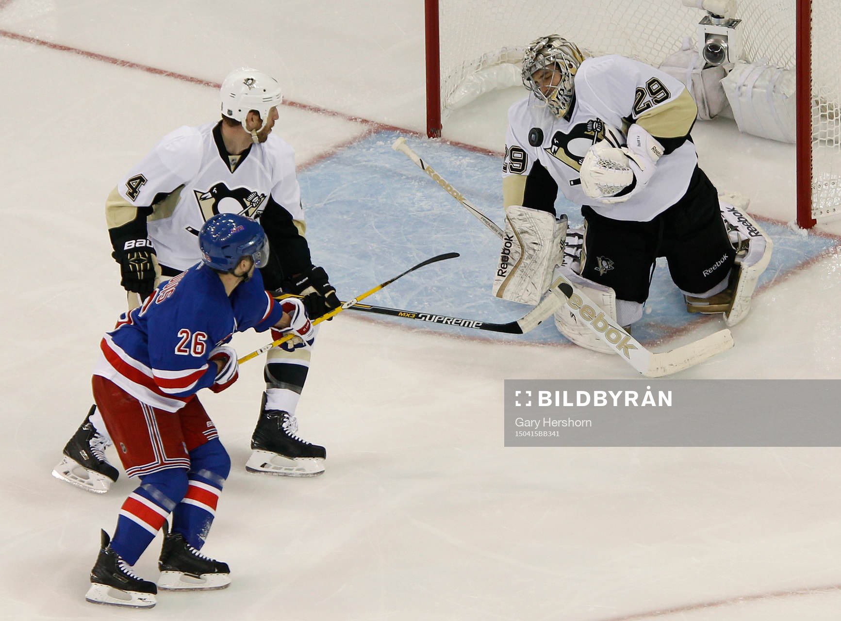 Pittsburgh Penguins goalie Marc-Andre Fleury (R) makes a