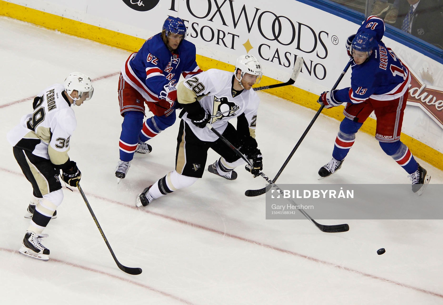 New York Rangers Carl Hagelin (2nd L) and Kevin Hayes fight
