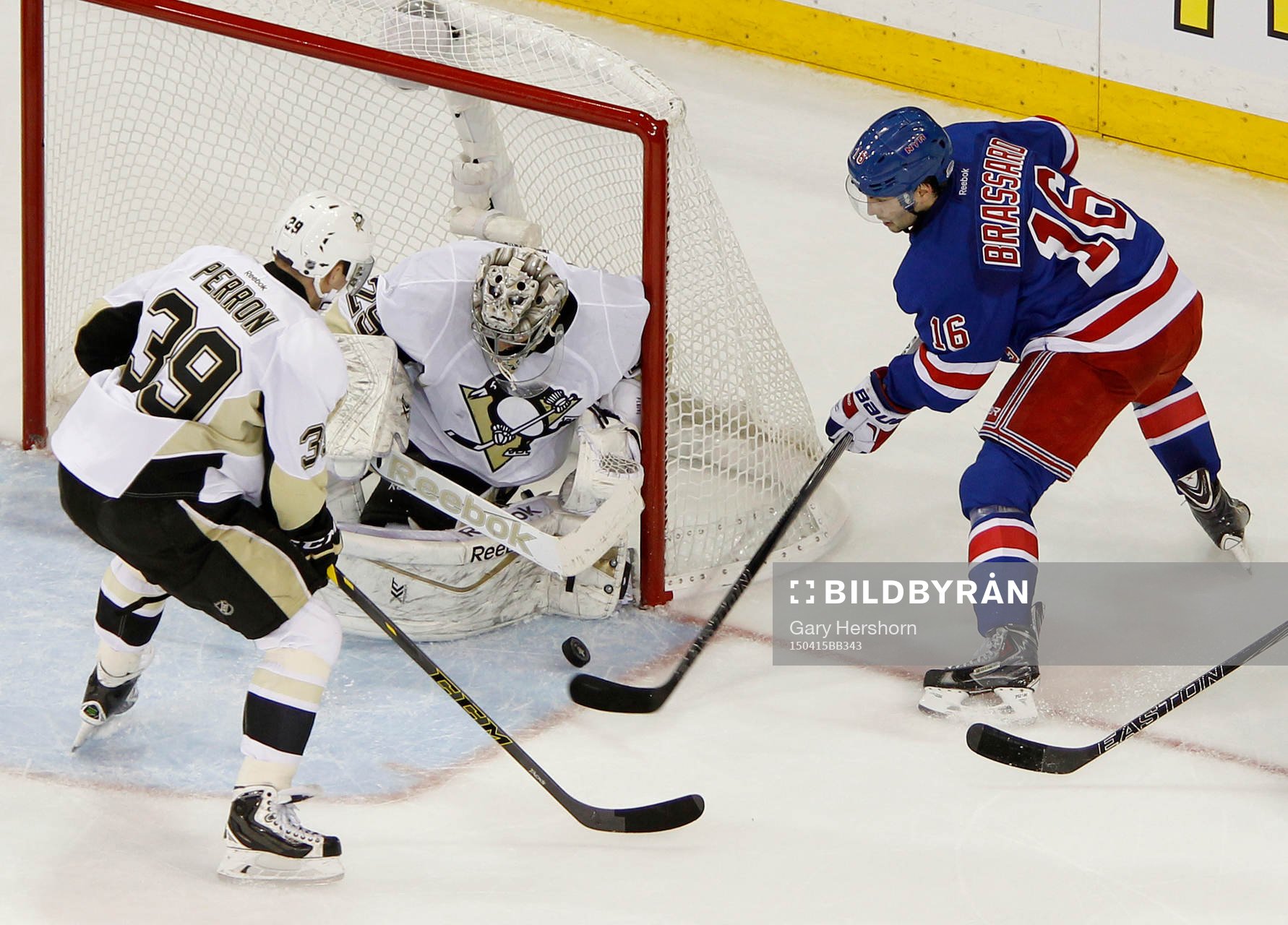Pittsburgh Penguins goalie Marc-Andre Fleury (C) makes a