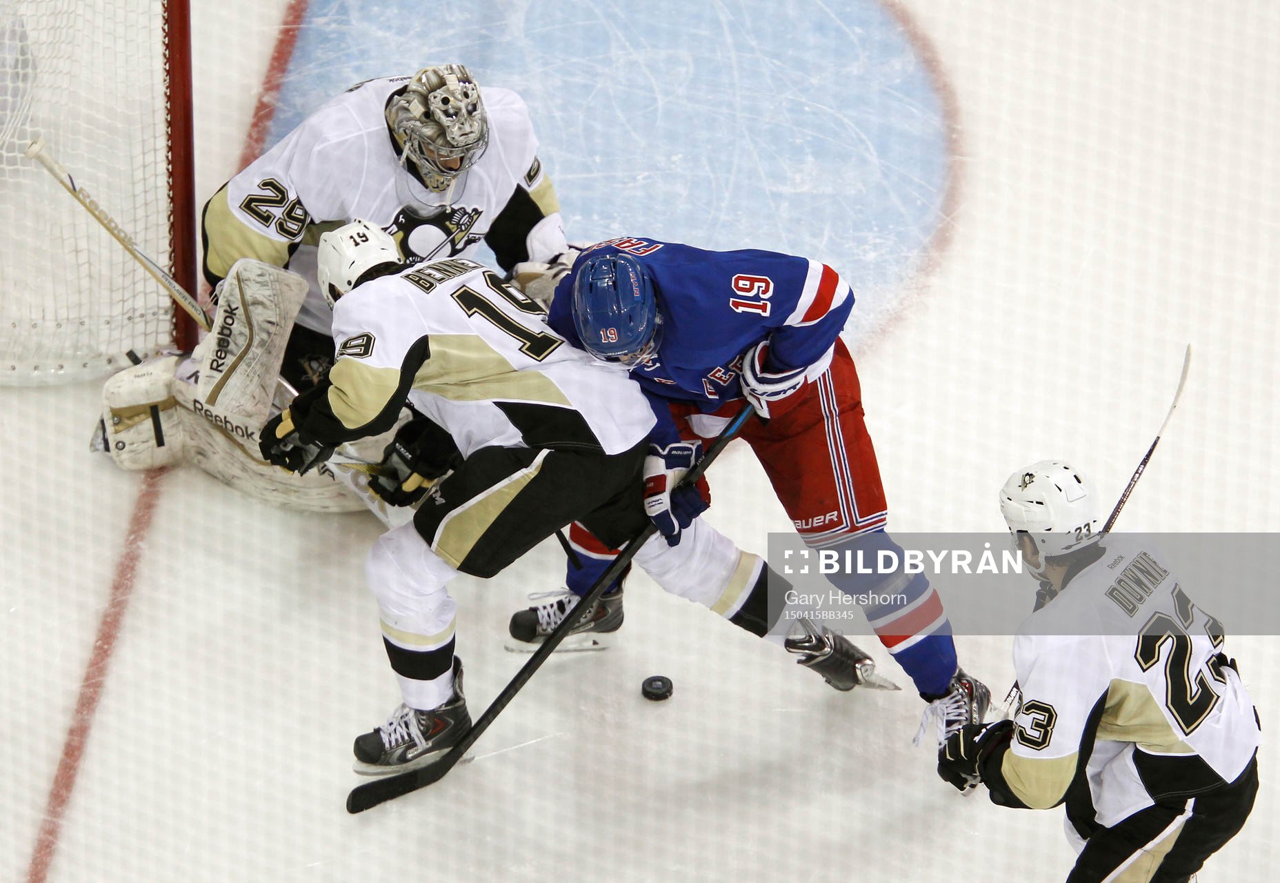 New York Rangers Jesper Fast (2nd R) fights for the puck