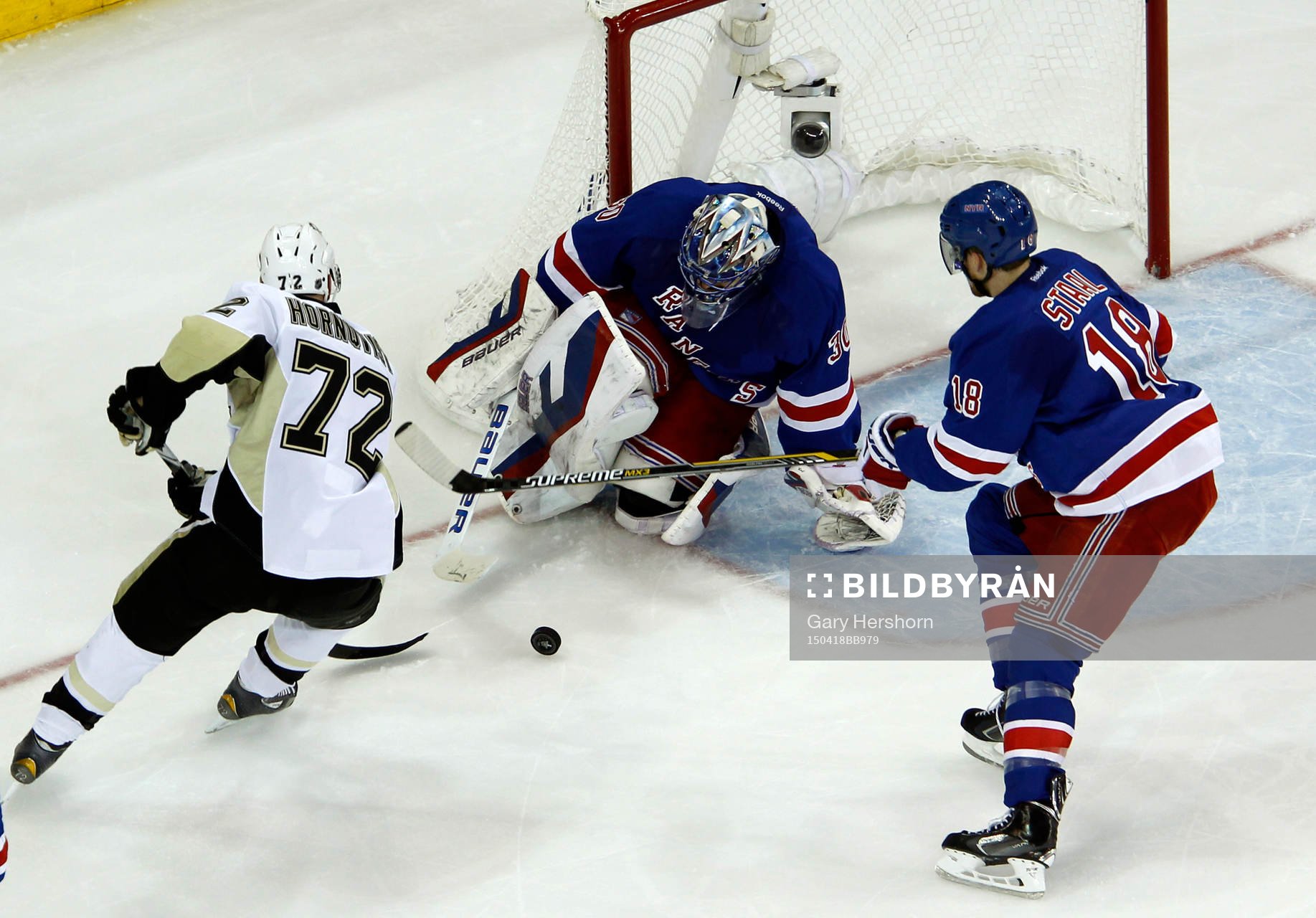 New York Rangers goalie Henrik Lundqvist makes a save in