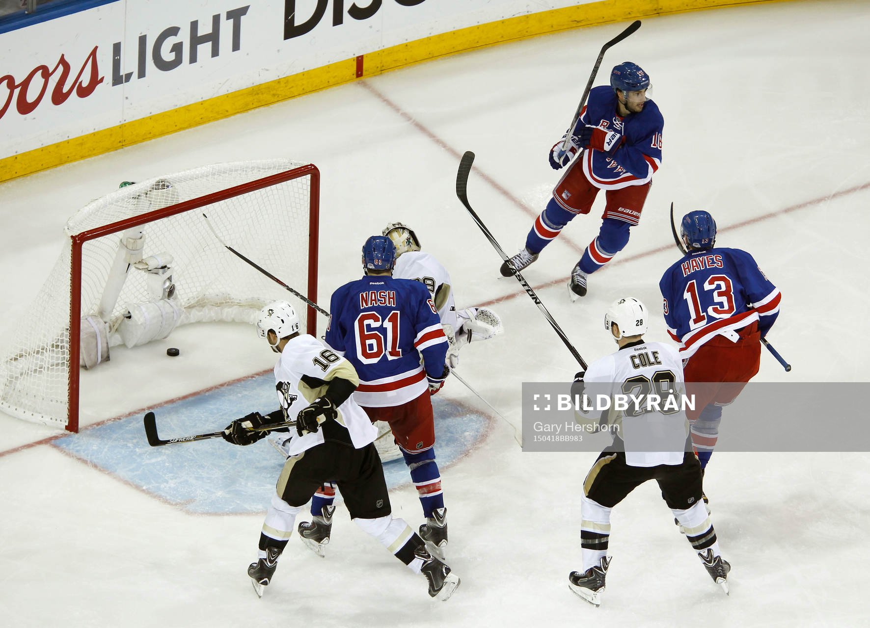 New York Rangers Derick Brassard (top R) celebrates scoring
