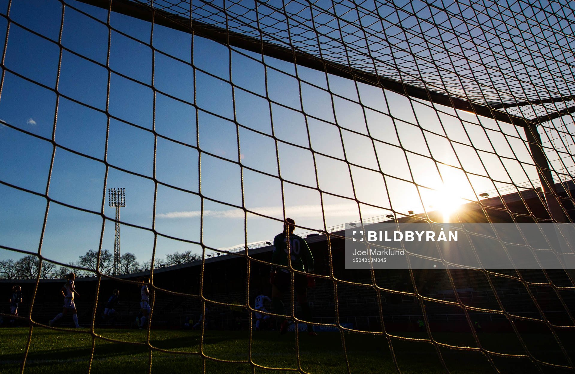 Solen går ner över Stadion