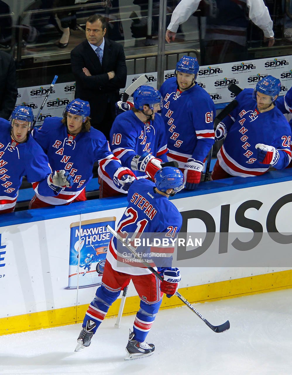 New York Rangers Derek Stepan slaps hands with teammate