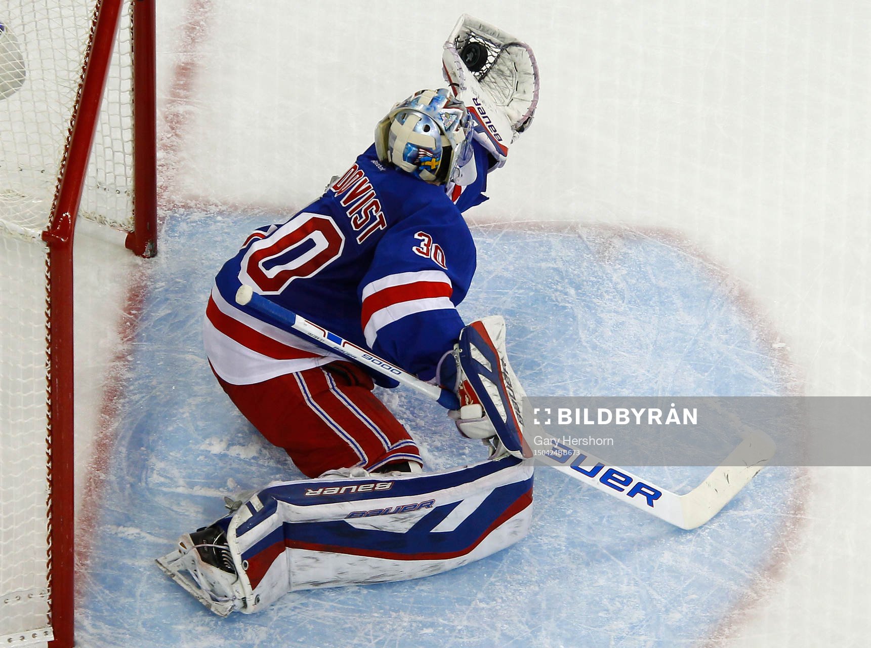 New York Rangers goalie Henrik Lundqvist makes a glove save