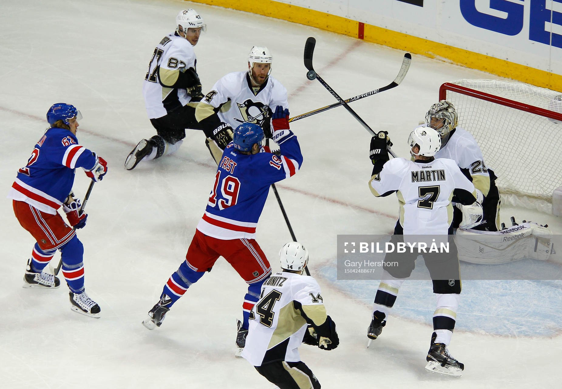 New York Rangers Jesper Fast (19) reaches for the puck with