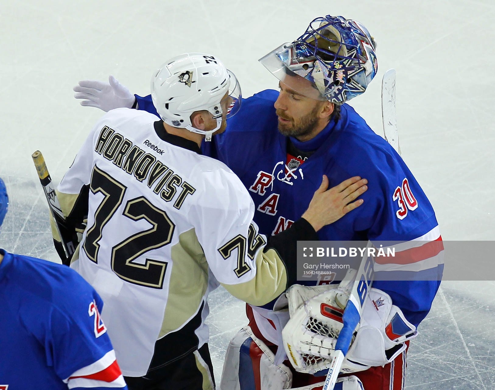 New York Rangers Henrik Lundqvist (R) embraces Pittsburgh