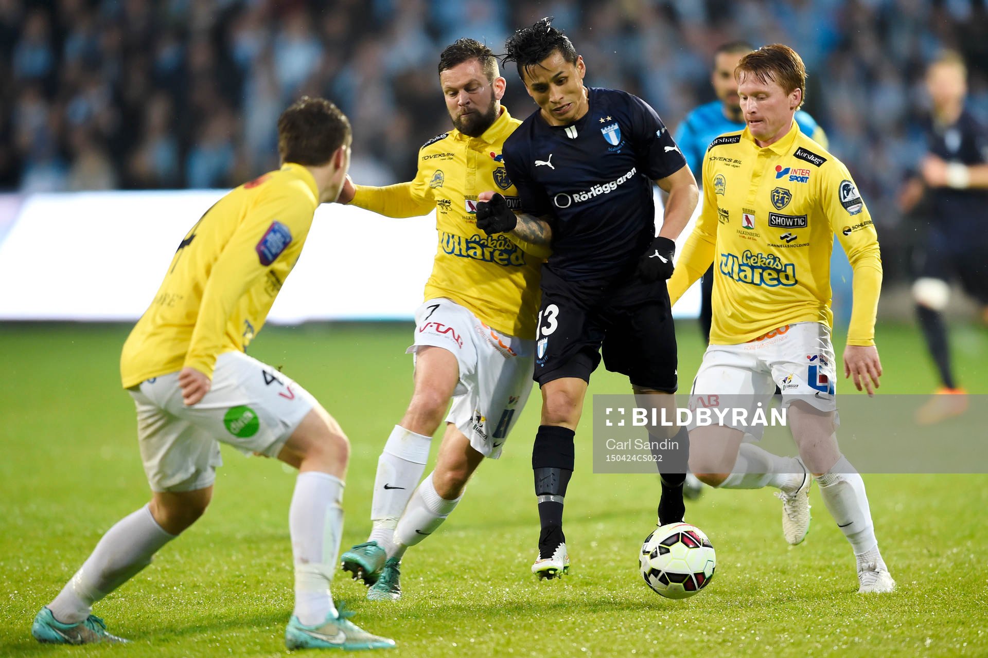 Falkenbergs David Svensson och Dan Keat och Malmö FFs Victor Yoshimar Yotun Flores under fotbollsmatchen i Allsvenskan mellan Falkenberg och Malmö FF den 24 April 2015 i Falkenberg.