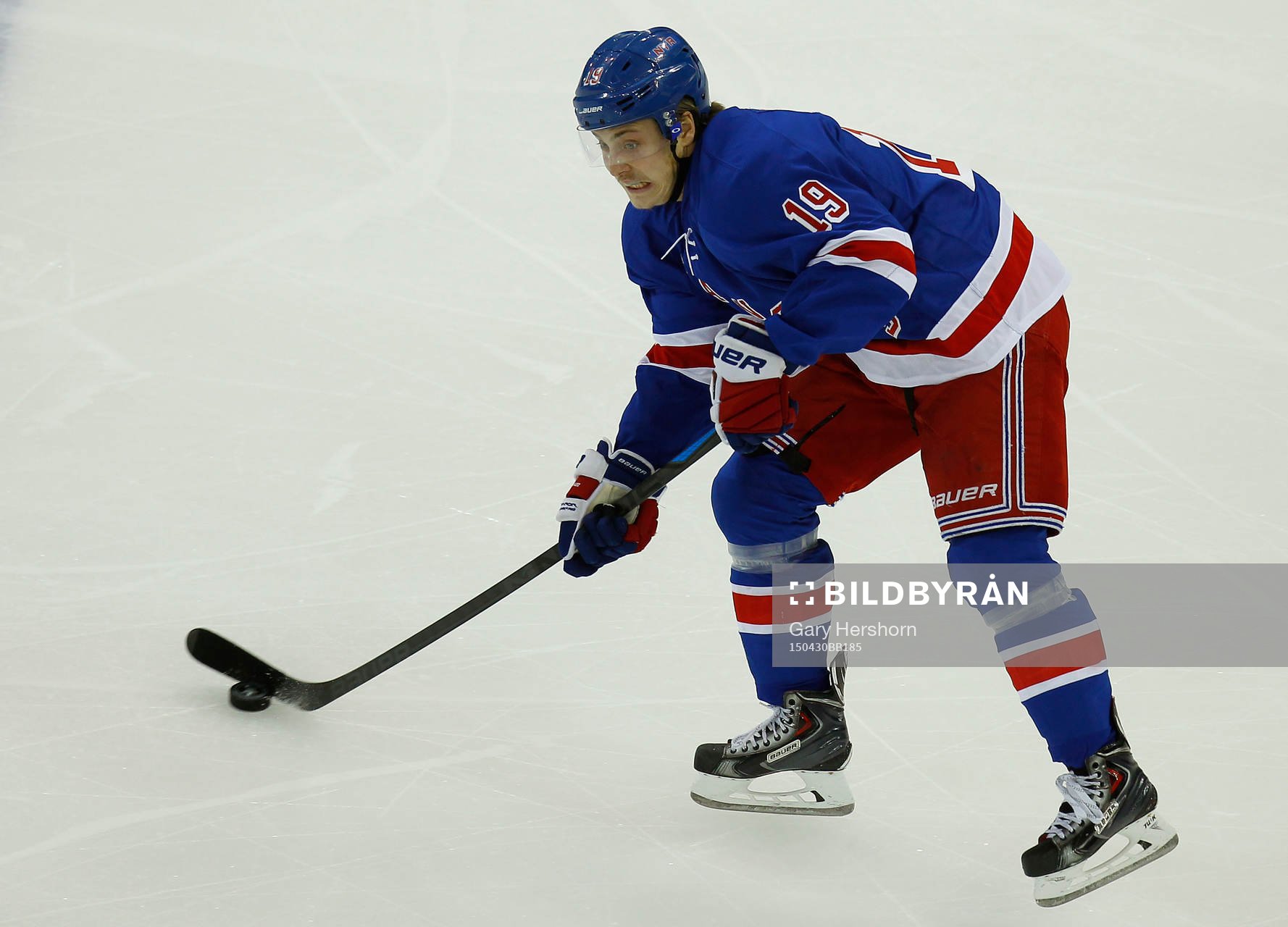 New York Rangers Jesper Fast passes the puck againt the
