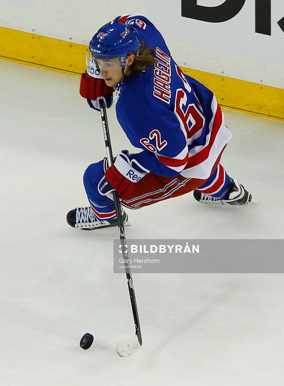 New York Rangers Carl Hagelin skates with the puck against