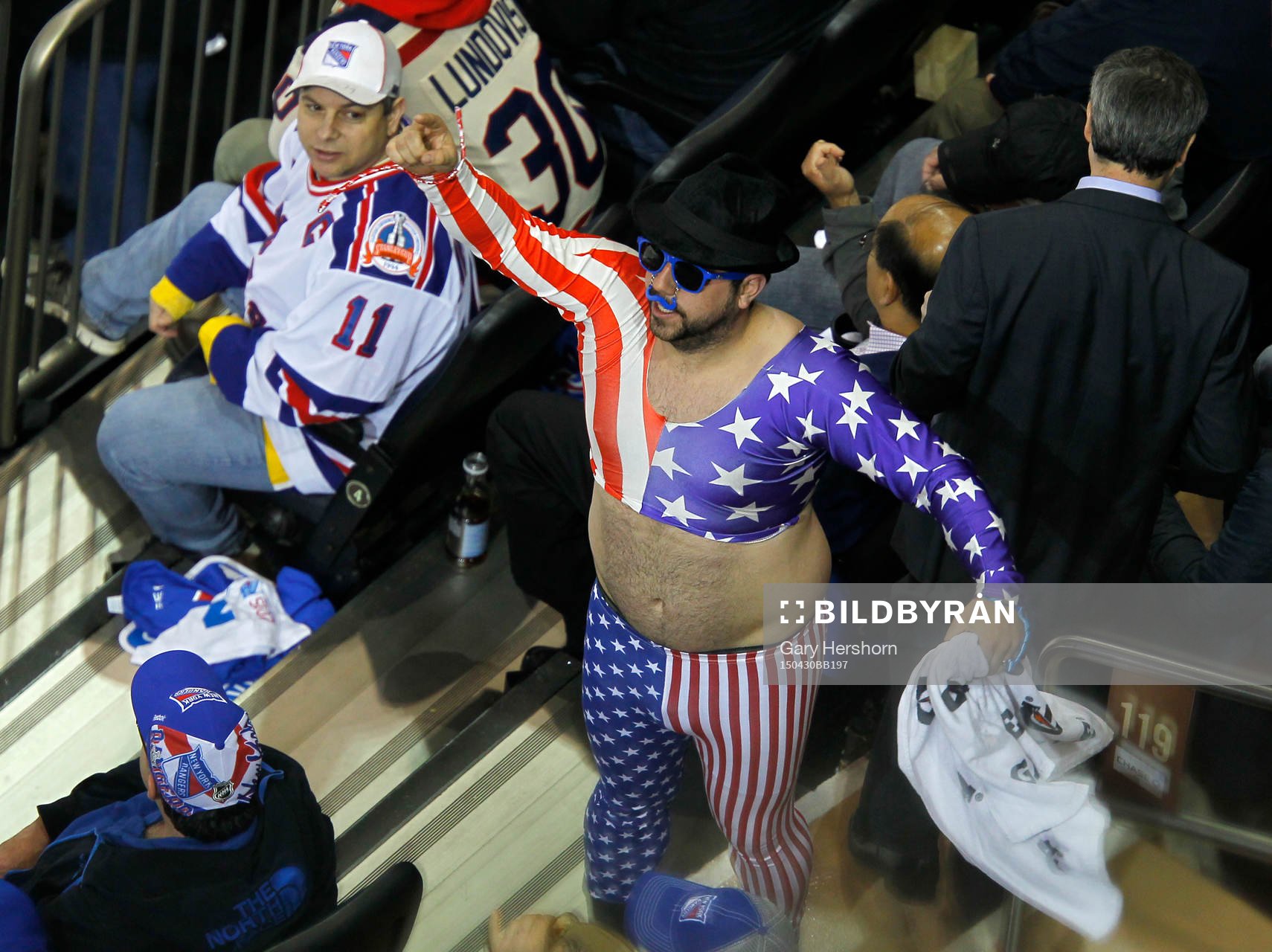 A fan cheers in the first period