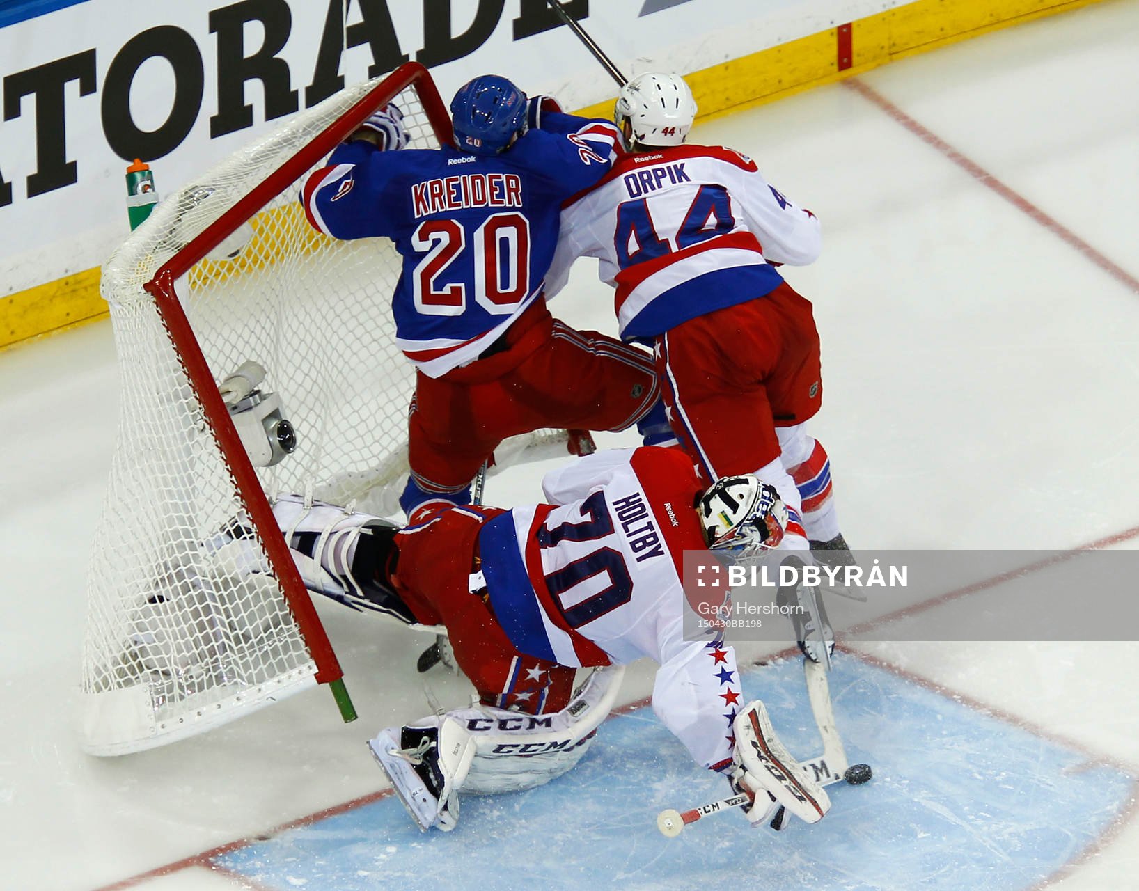 New York Rangers Chris Kreider is knocked into the net by