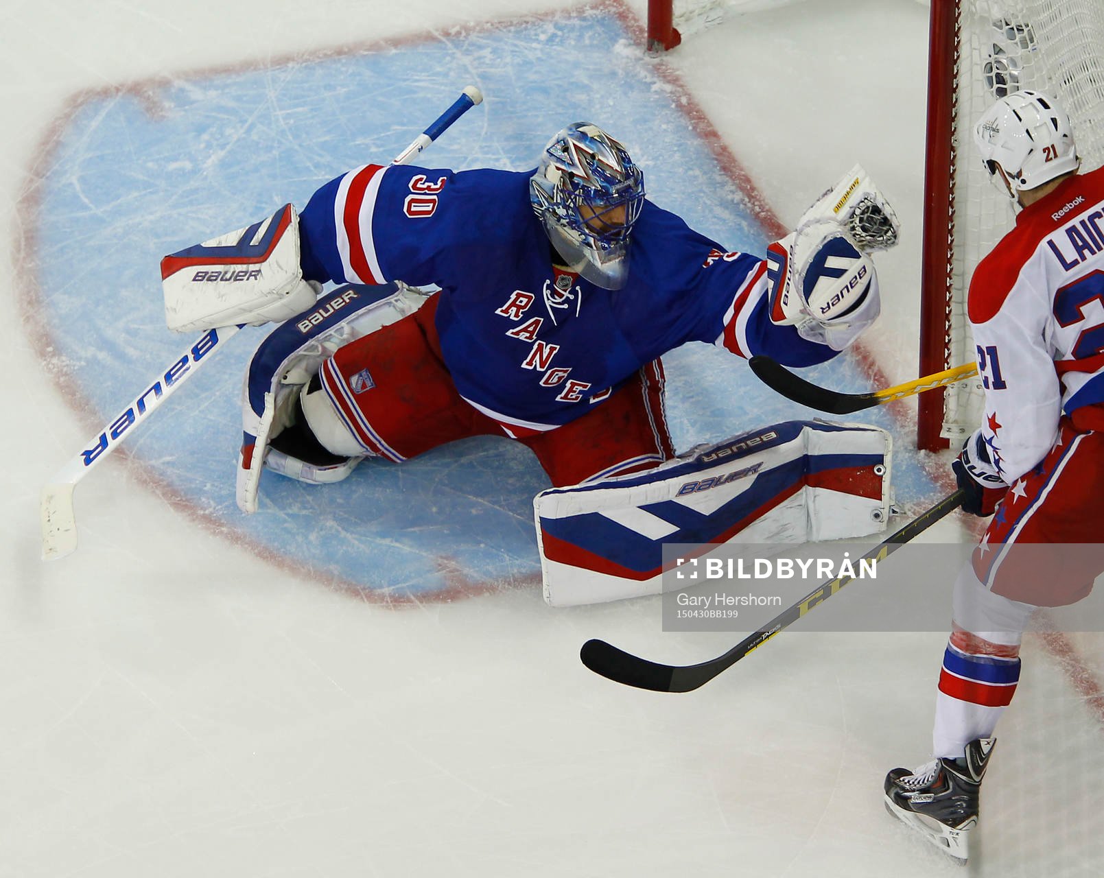 New York Rangers goalie Henrik Lundqvist makes a glove save