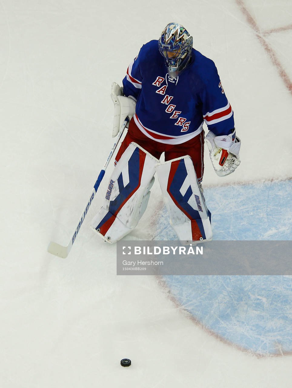 New York Rangers goalie Henrik Lundqvist shoots the puck