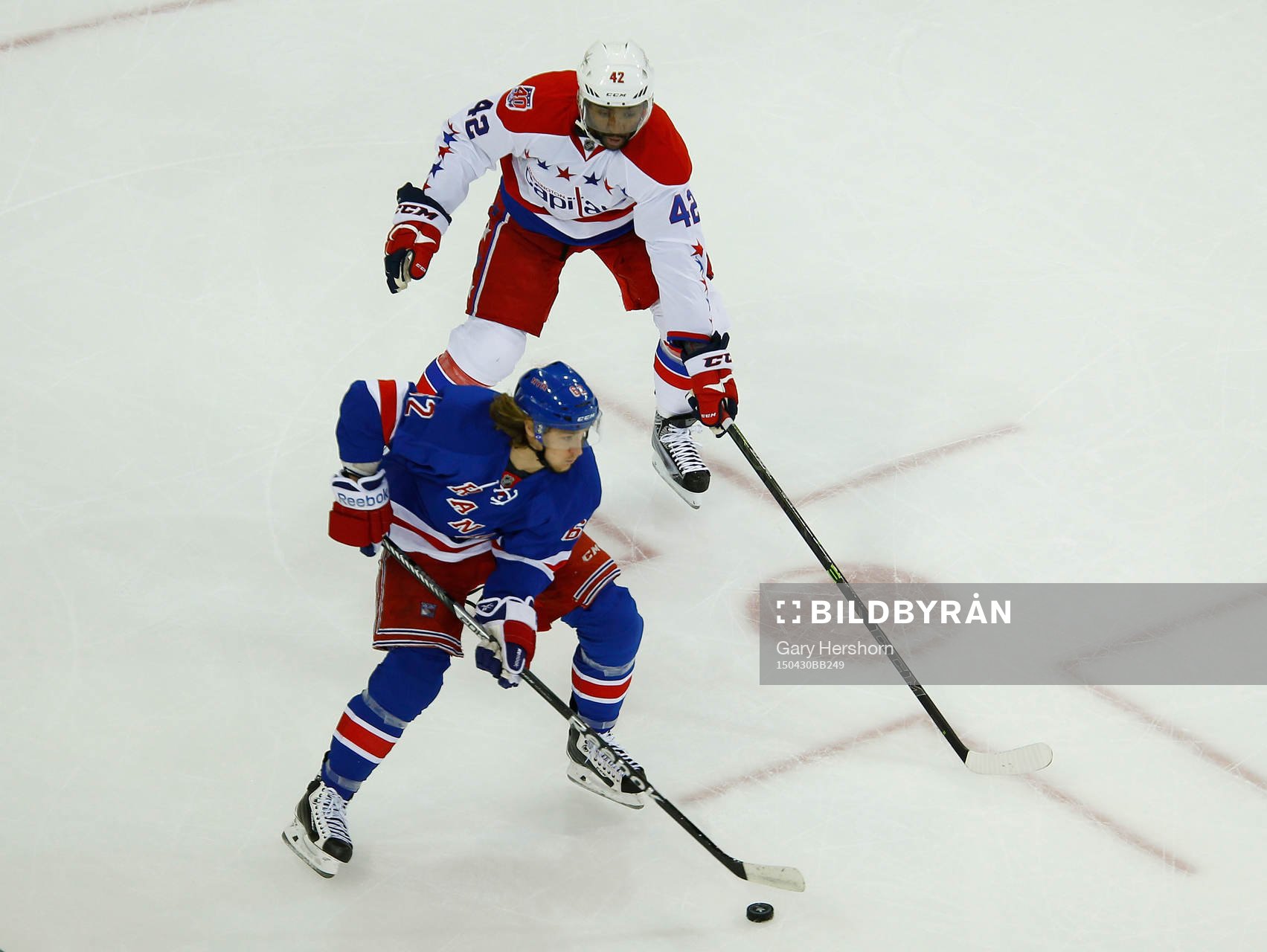 New York Rangers Carl Hagelin skates past Washington