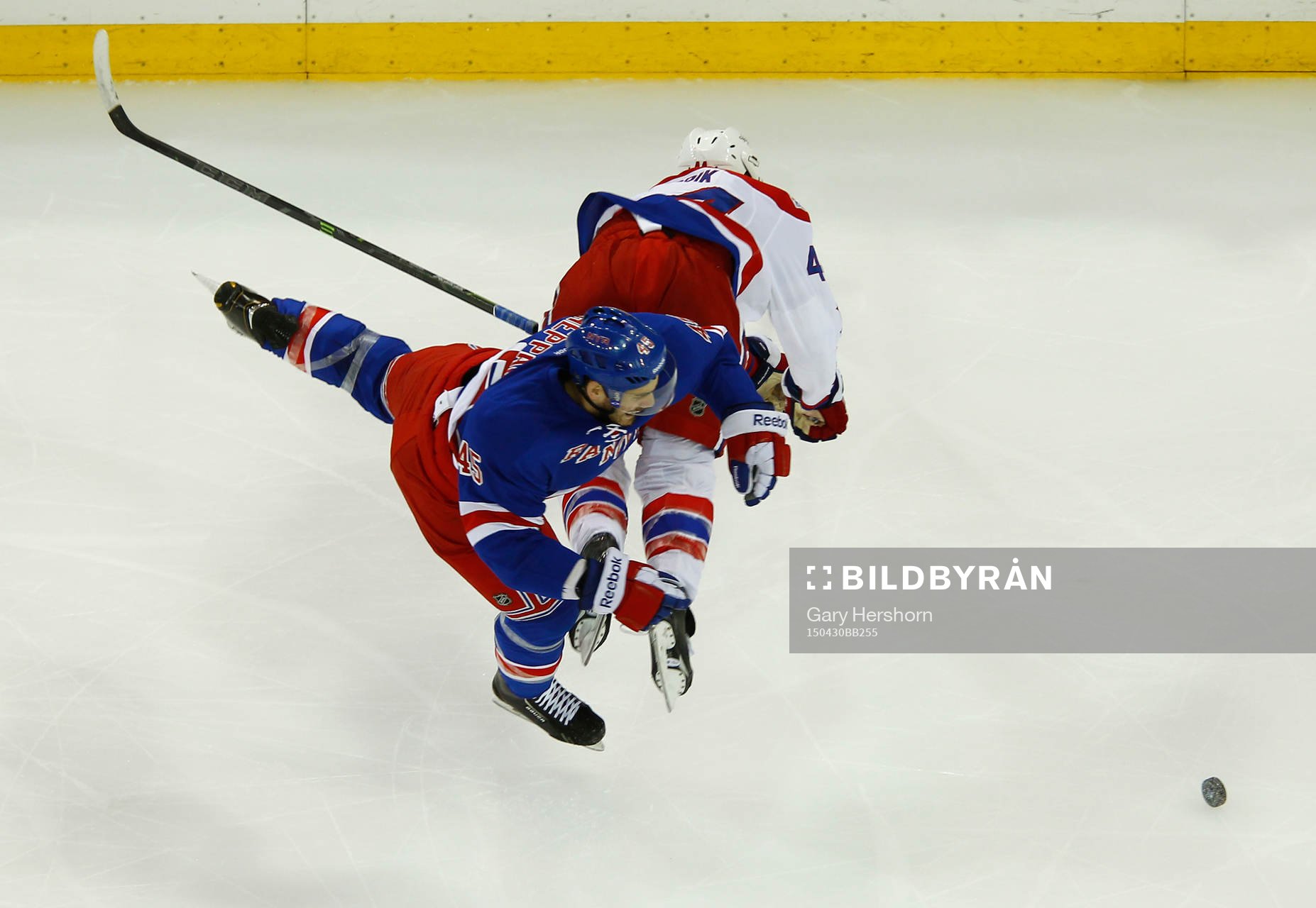 New York Rangers James Sheppard is sent flying by