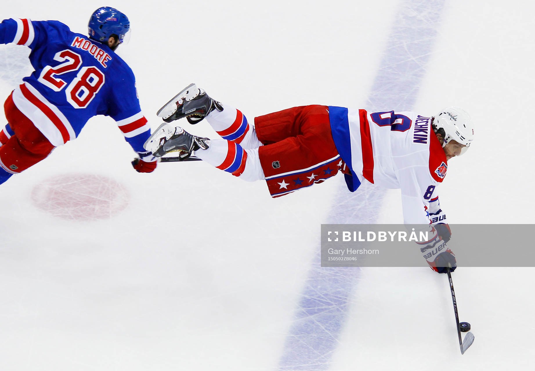 Washington Capitals Alex Ovechkin (R) is upended by New
