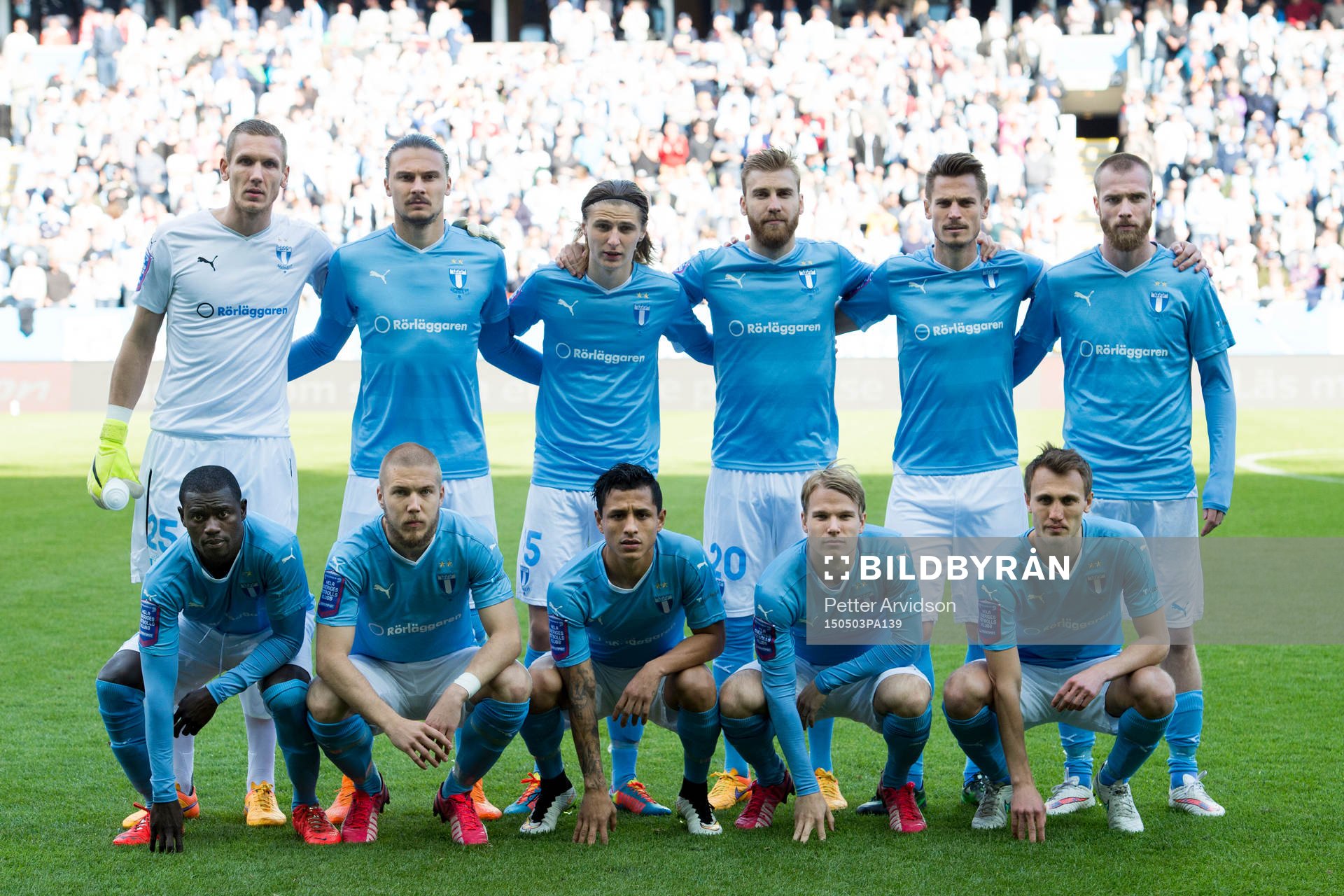 Malmö FFs spelare ställer upp för en lagbild, övre raden från vänster, målvakt Robin Olsen, Erik Johansson, Pawel Cibicki, Rasmus Bengtsson, Markus Rosenberg och Jo Inge Berget. Nedre raden från vänster, Enoch Kofi Adu, Anton Tinnerholm, Victor Yoshimar Yotun Flores, Oscar Lewicki och Magnus Wolff Eikrem under fotbollsmatchen i Allsvenskan mellan Malmö FF och Helsingborg den 3 maj 2015 i Malmö.