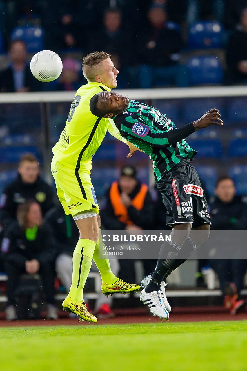 Jönköpings Södras Joakim Karlsson och Varbergs Nsima Peter under fotbollsmatchen i Superettan mellan Varberg och Jönköping den 5 maj 2015 i Varberg.