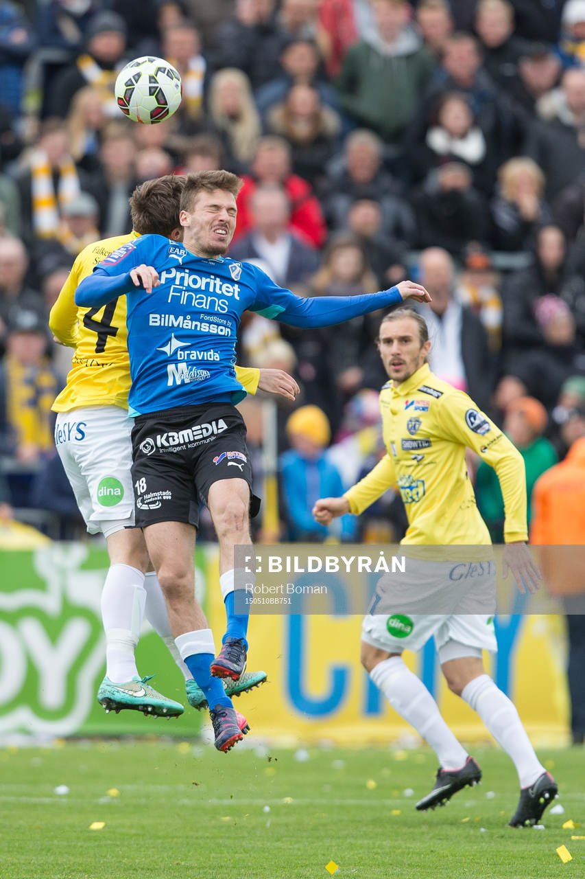 Halmstads Shkodran Maholli i luftduell med Falkenbergs Daniel Johansson under fotbollsmatchen i Allsvenskan mellan Falkenbergs FF och Halmstads BK den 10 maj 2015 i Falkenberg.