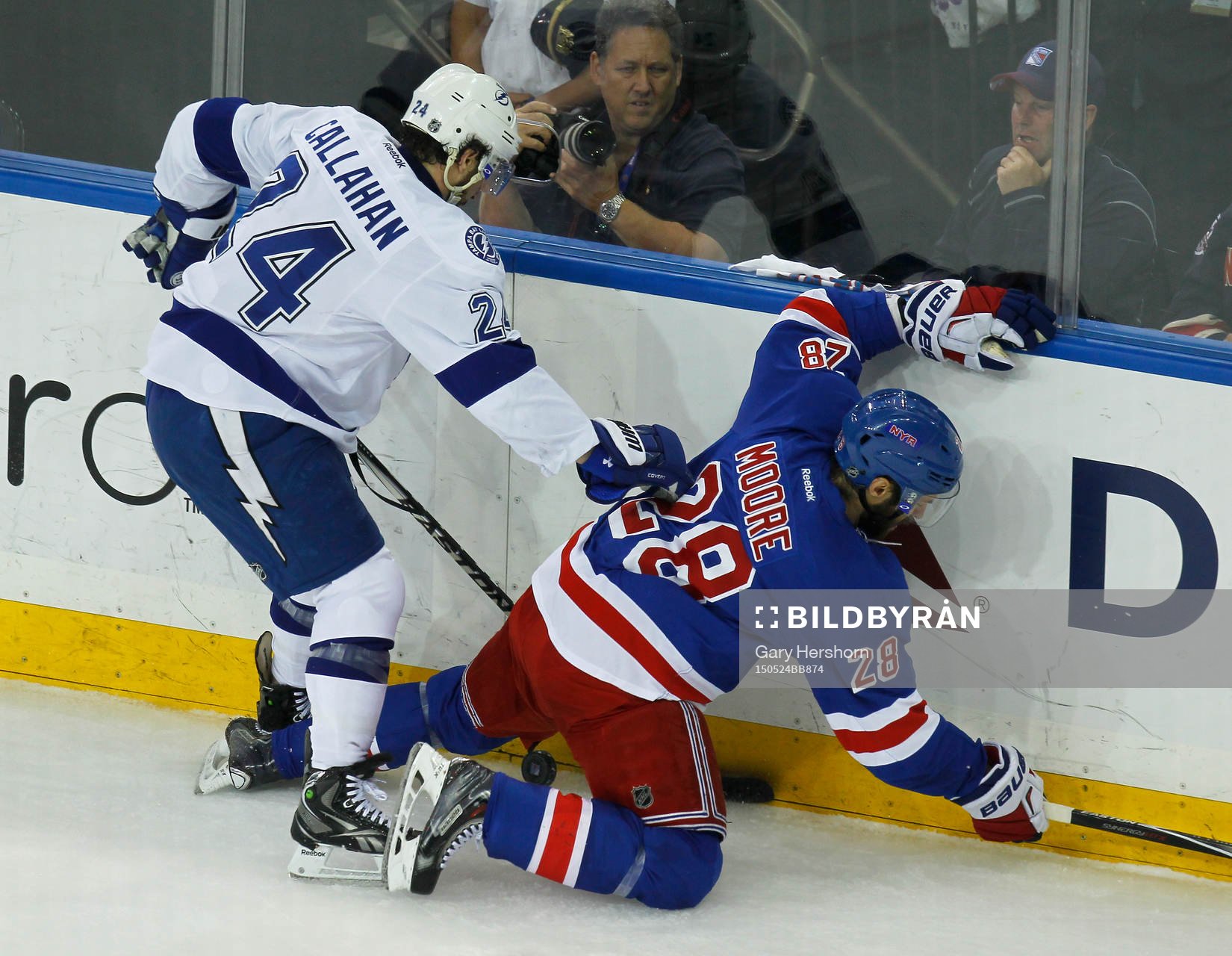 Tampa Bay Lightning Ryan Callaghan (L) checks New York